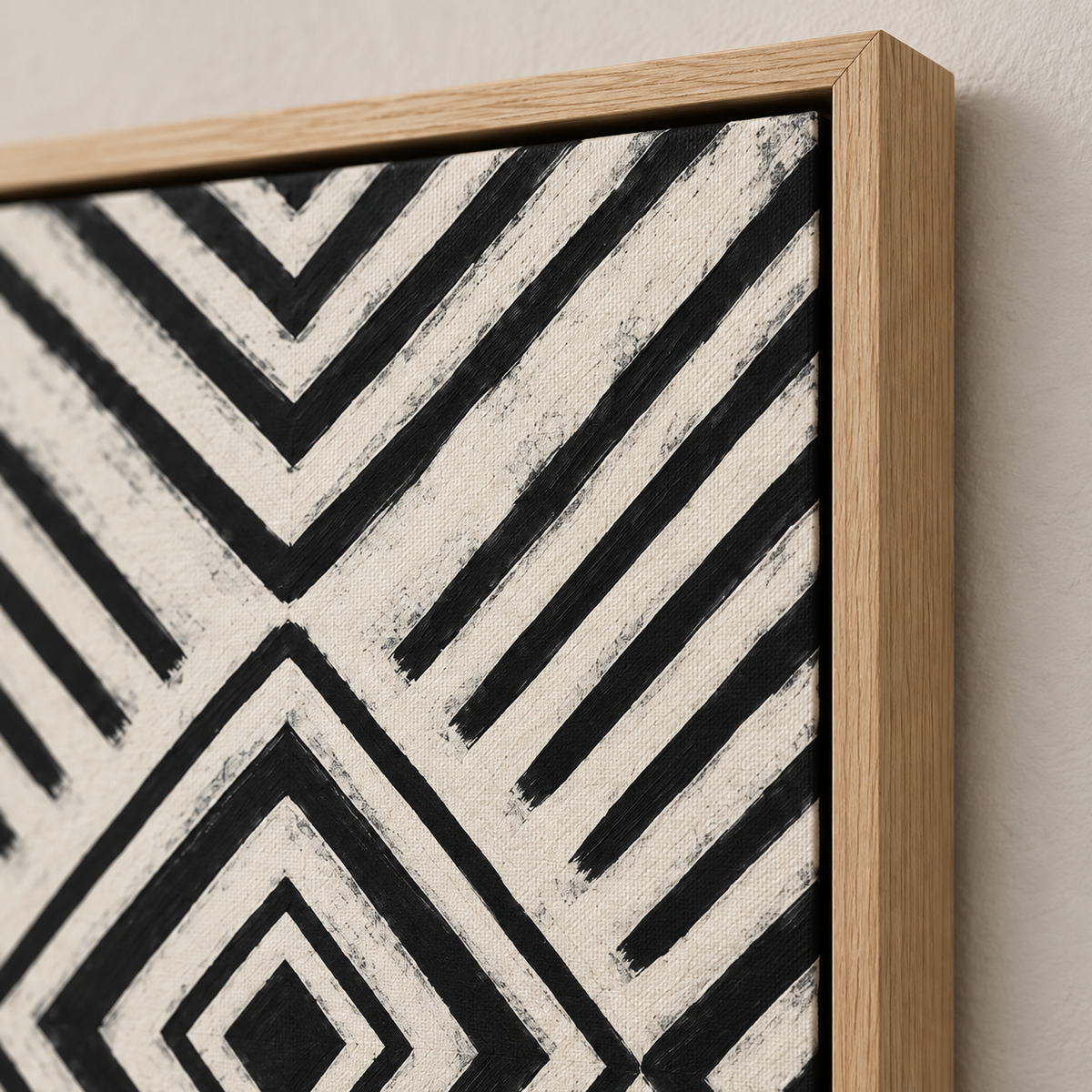 Close-up corner detail showing the texture and oak floater frame of the geometric canvas print