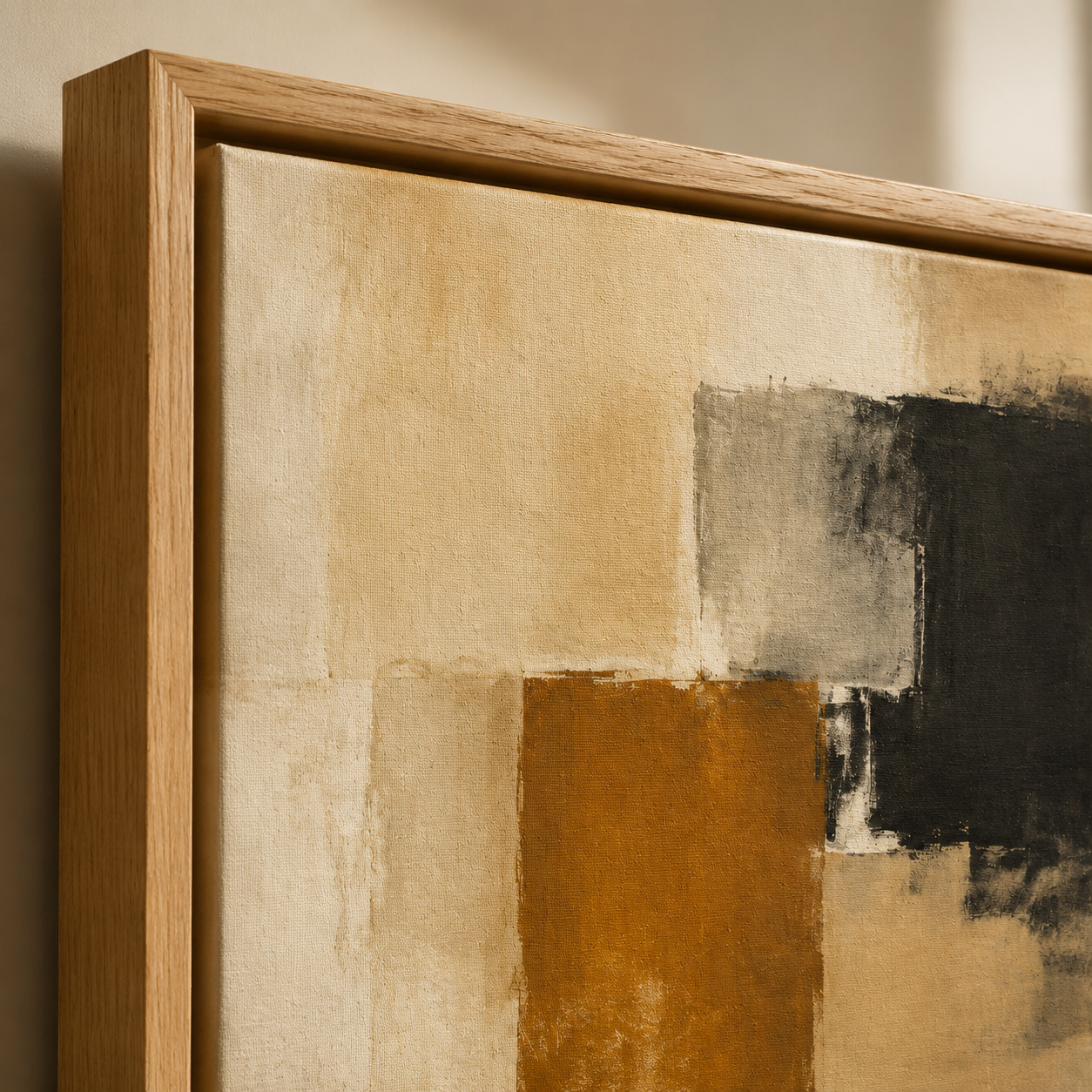 Close-up detail of the color-block texture and natural wood frame corner on the Amber Divide painting
