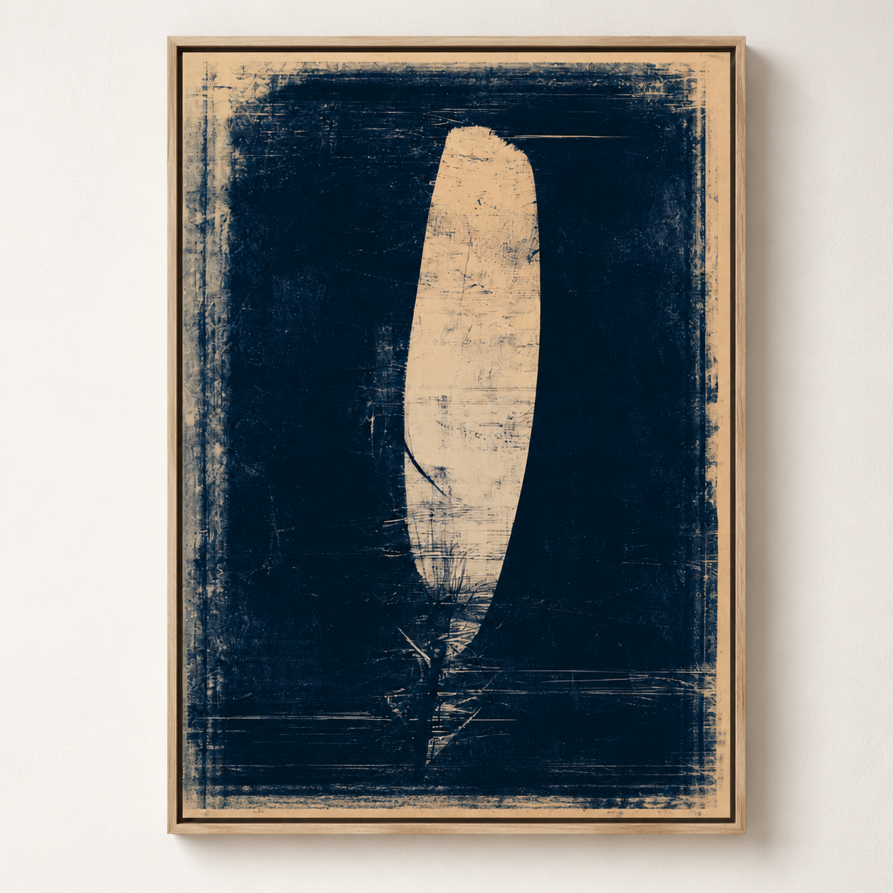 Feather painting, Still Flight, shown at an angle in an oak floater frame