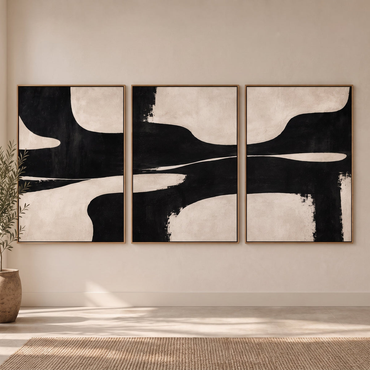 Black Tide black and white wall art set of 3 displayed in an entryway