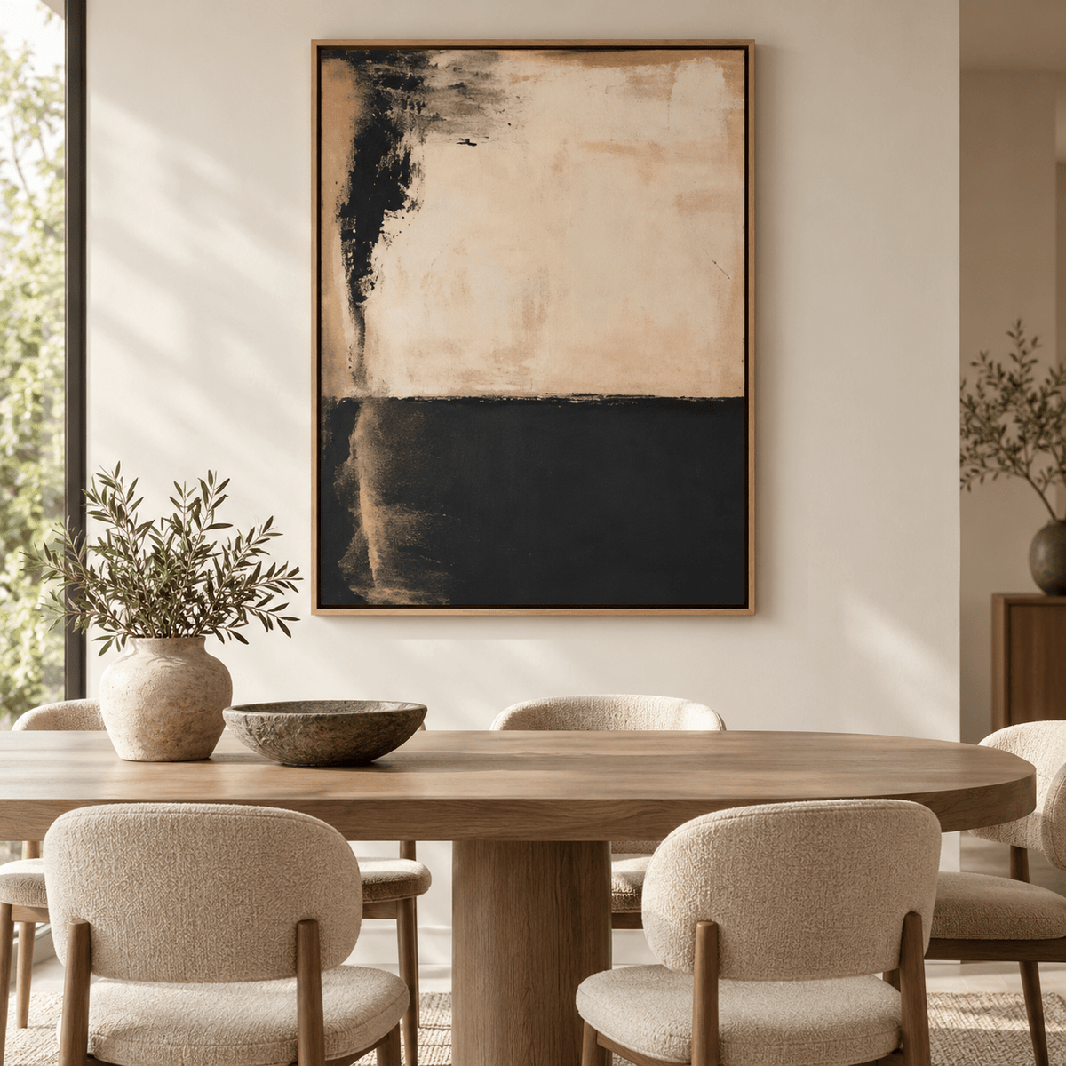 Black and beige painting – Ember Divide above a dining table