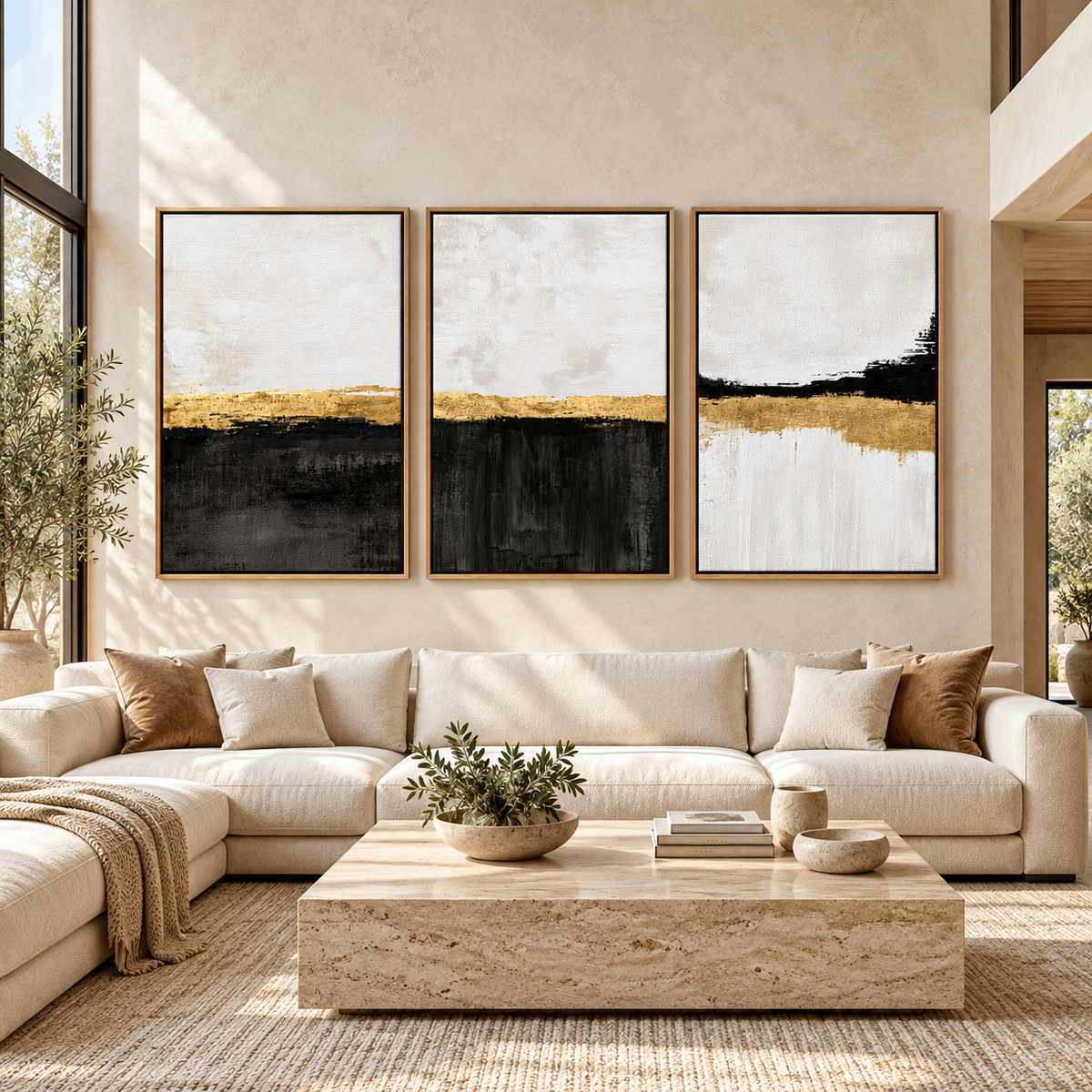 Black White and Gold Wall Art Set of 3 – Gilded Shoreline above a cream sectional sofa in a living room by Rossetti Art