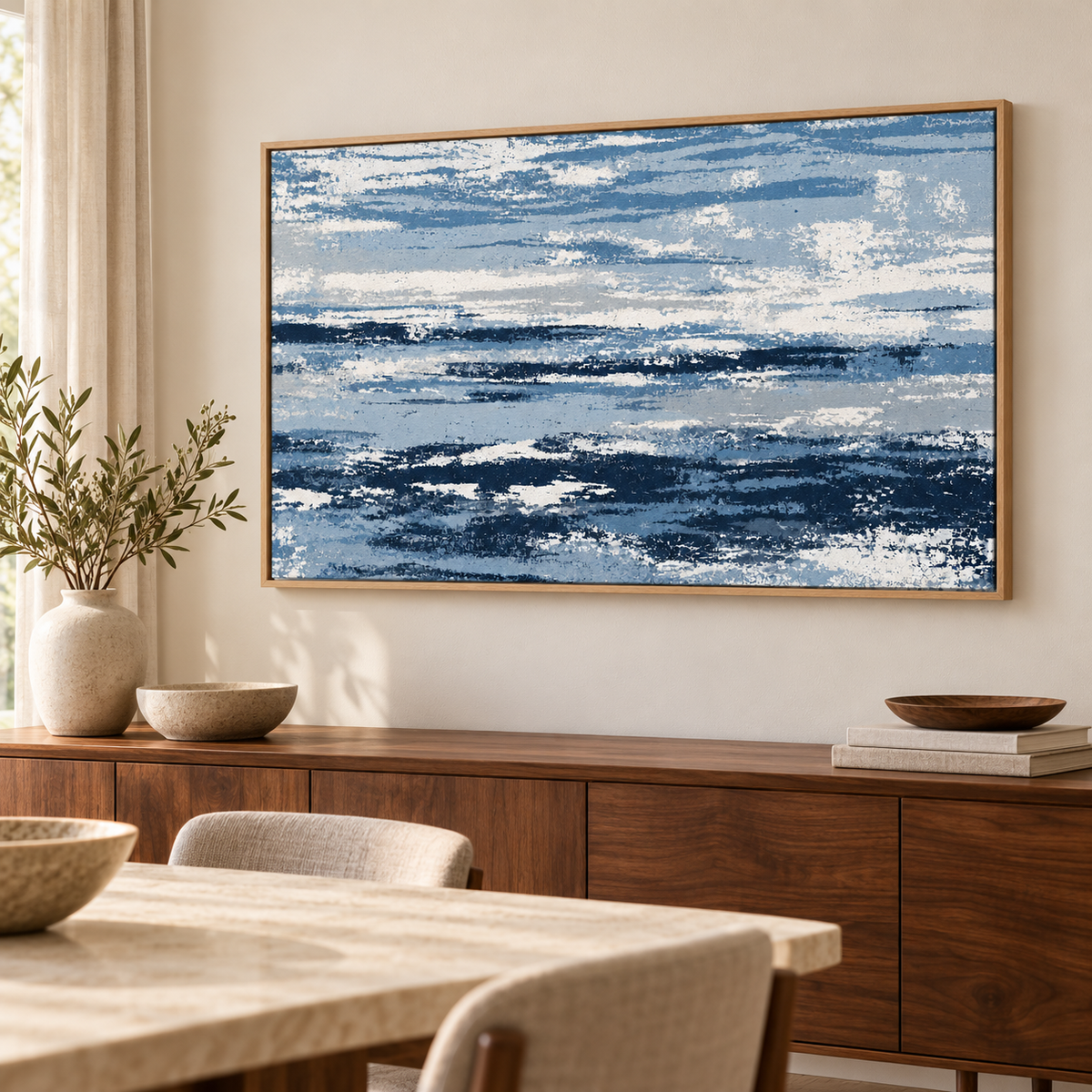 Blue and White Wall Art – Salt Current by Rossetti Art – framed blue and white abstract above a walnut sideboard in a dining room