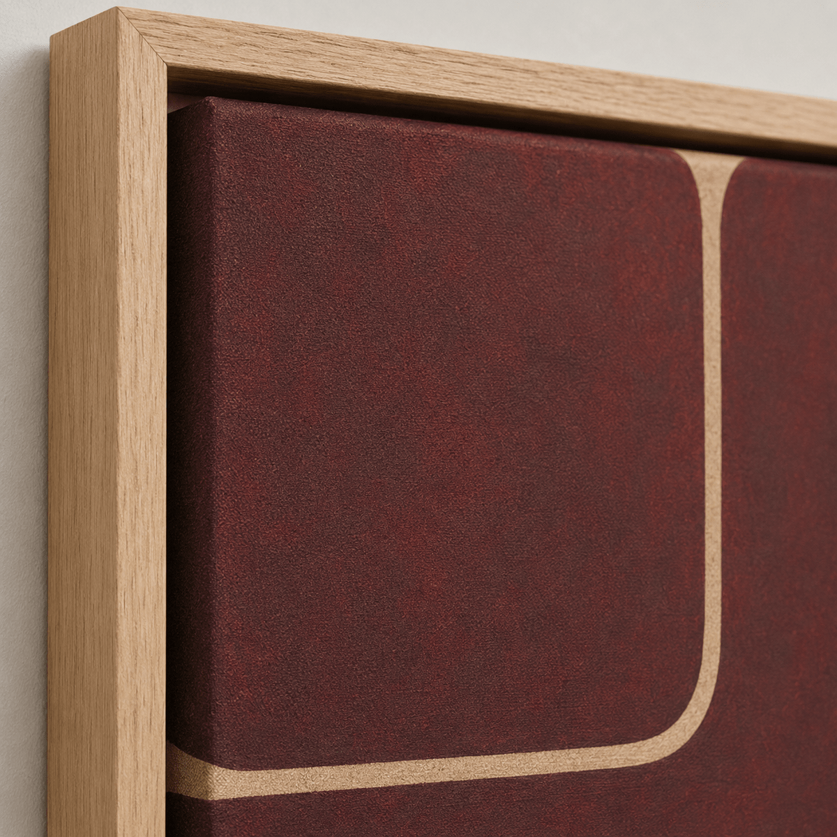 Close-up of the oak floater frame and textured canvas on Quiet Divide, a burgundy wall art canvas print by Rossetti Art