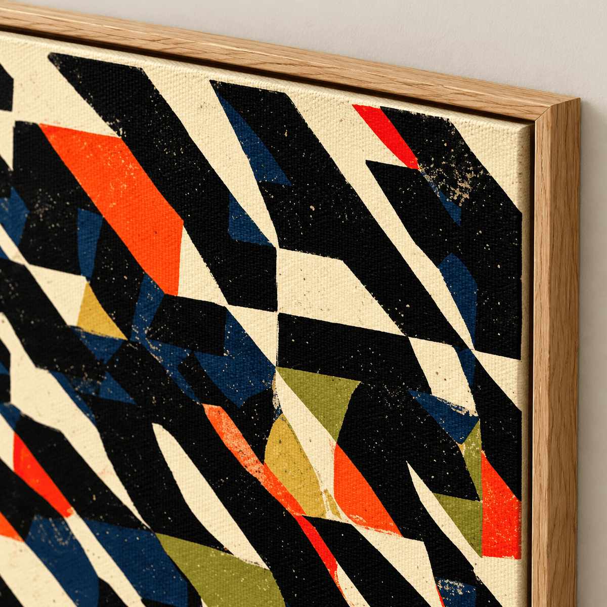 Close-up of the fragmented geometric print texture and oak floater frame corner on Fractured Signal canvas print