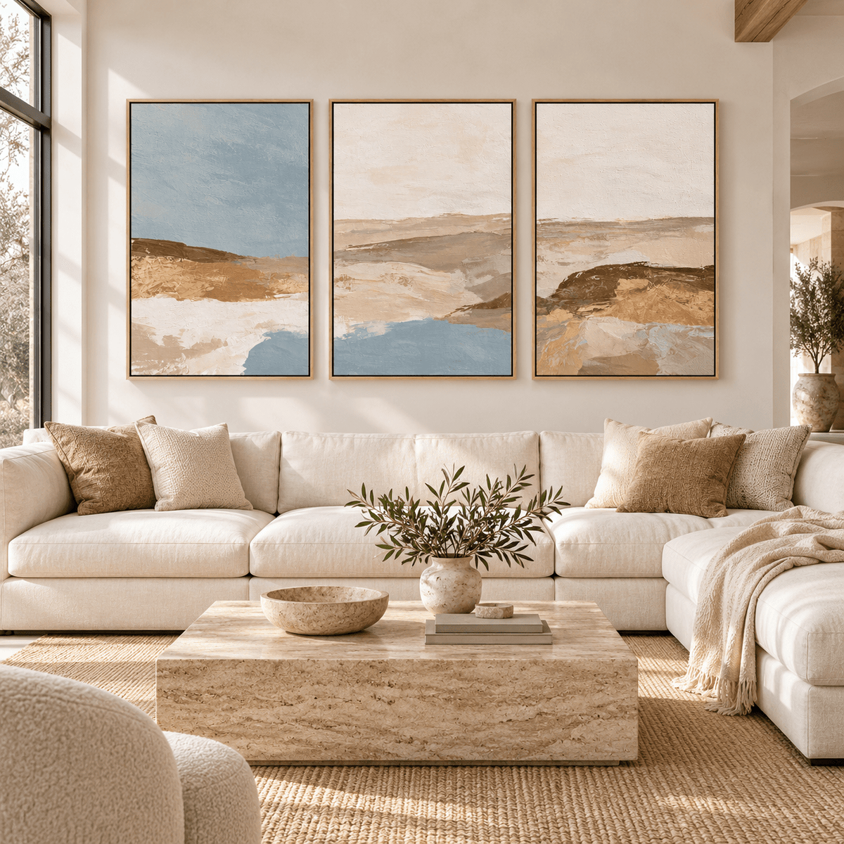 Blue and Tan Wall Art – Sand and Sky canvas print set of 3 by Rossetti Art, framed trio above a sofa