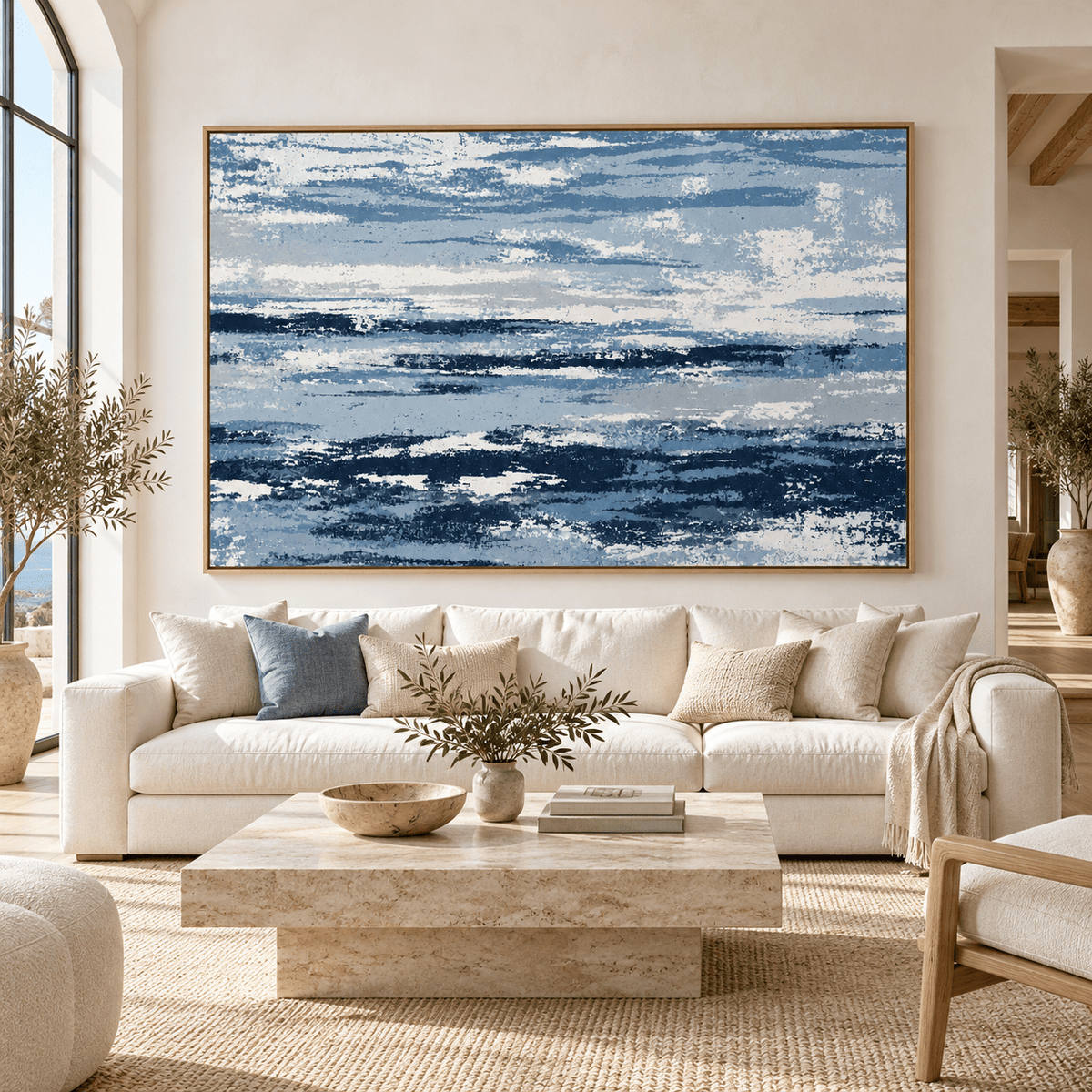 Blue and White Wall Art – Salt Current by Rossetti Art – large navy, denim and white abstract canvas above a cream sofa in an arched living room