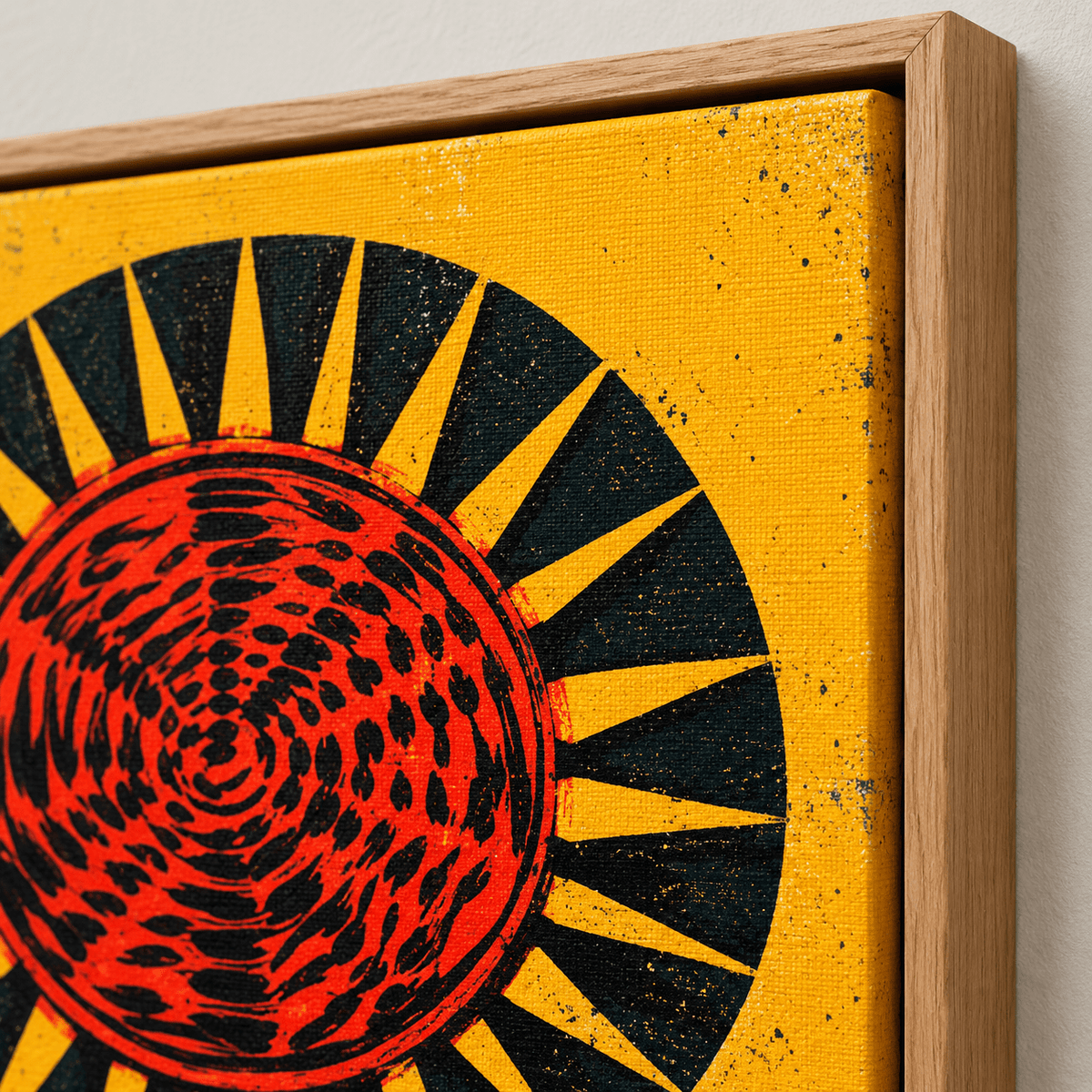 Close-up of the red and black sun disc print and oak floater frame corner on Solar Flare canvas print