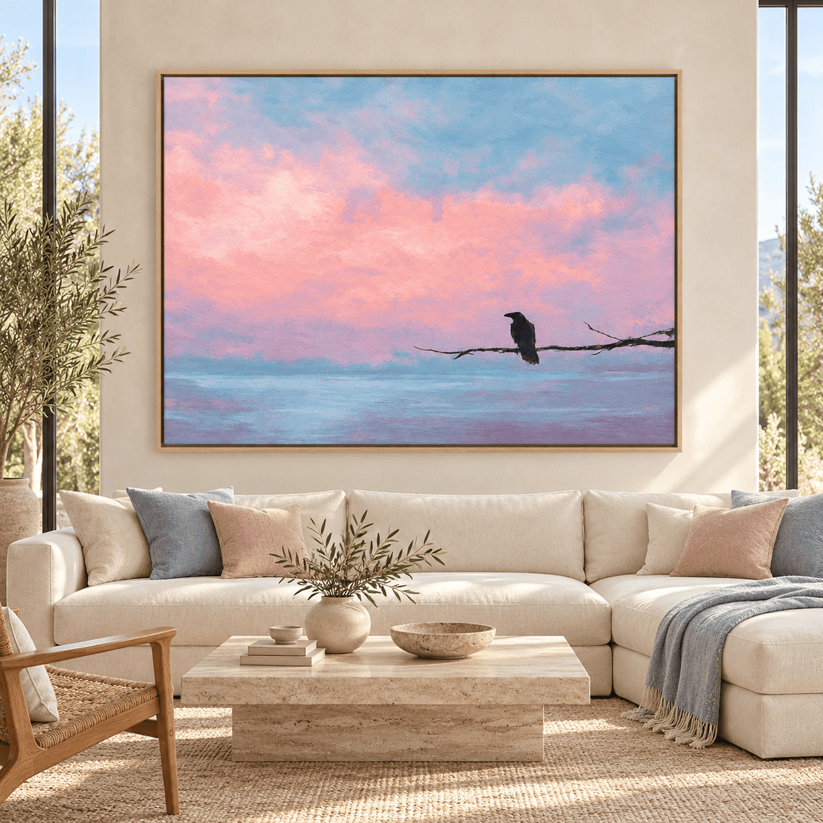 Raven wall art Quiet Perch above a cream sectional sofa in a bright living room
