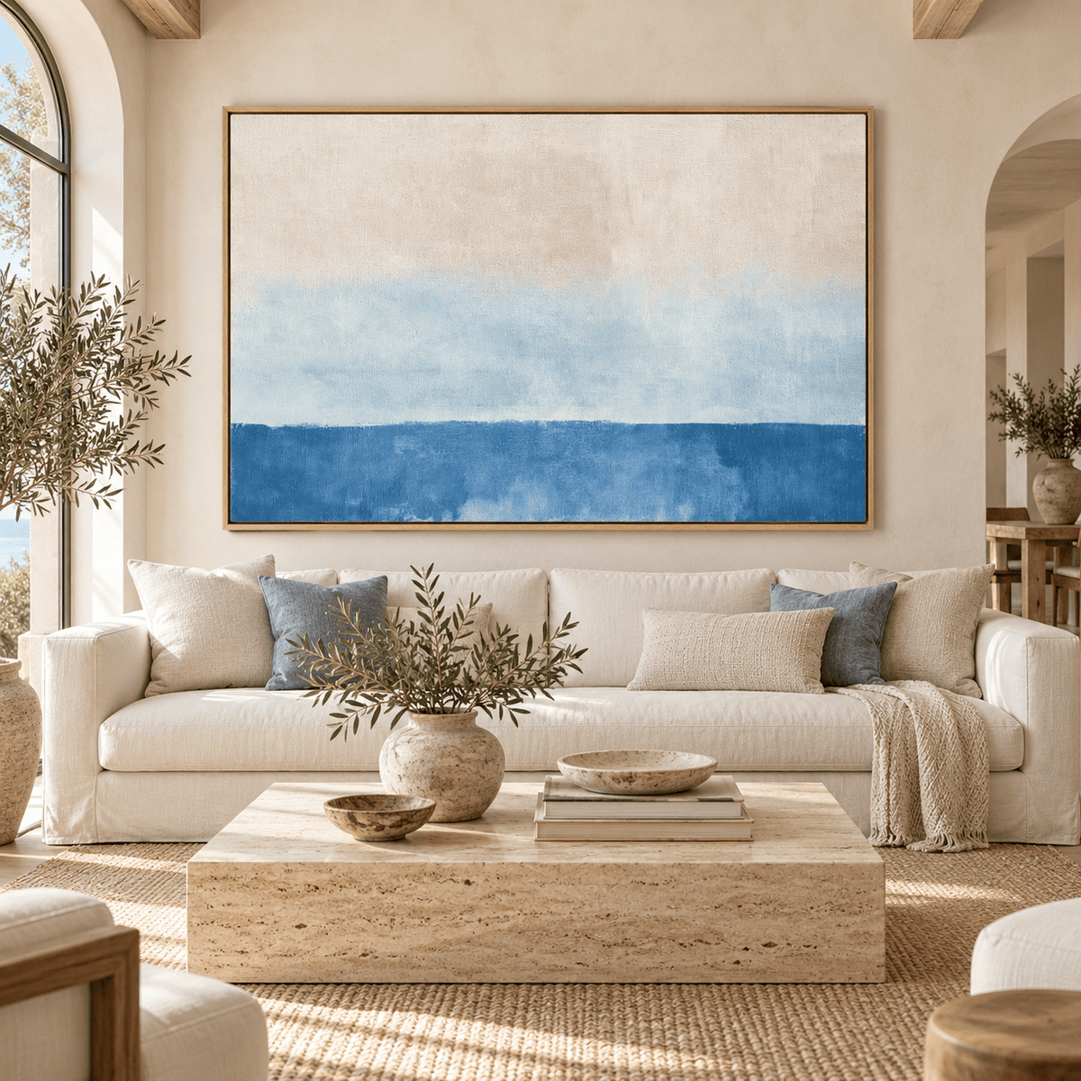 Salt wash blue and beige canvas print Linen Horizon above a cream sofa in a living room – Rossetti Art