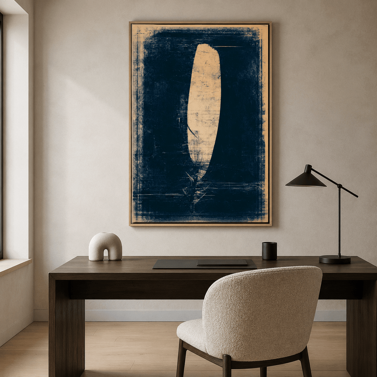 Feather painting displayed above a desk in a home office