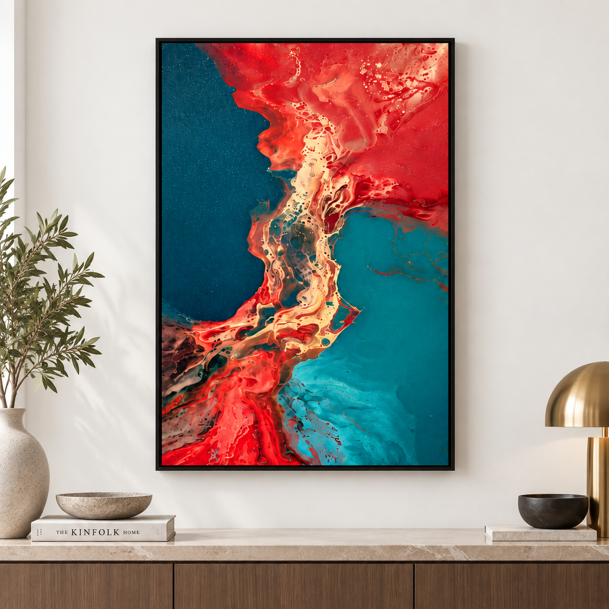 Fluid art – Molten Delta red and teal abstract acrylic print in a black frame above a wooden sideboard by Rossetti Art