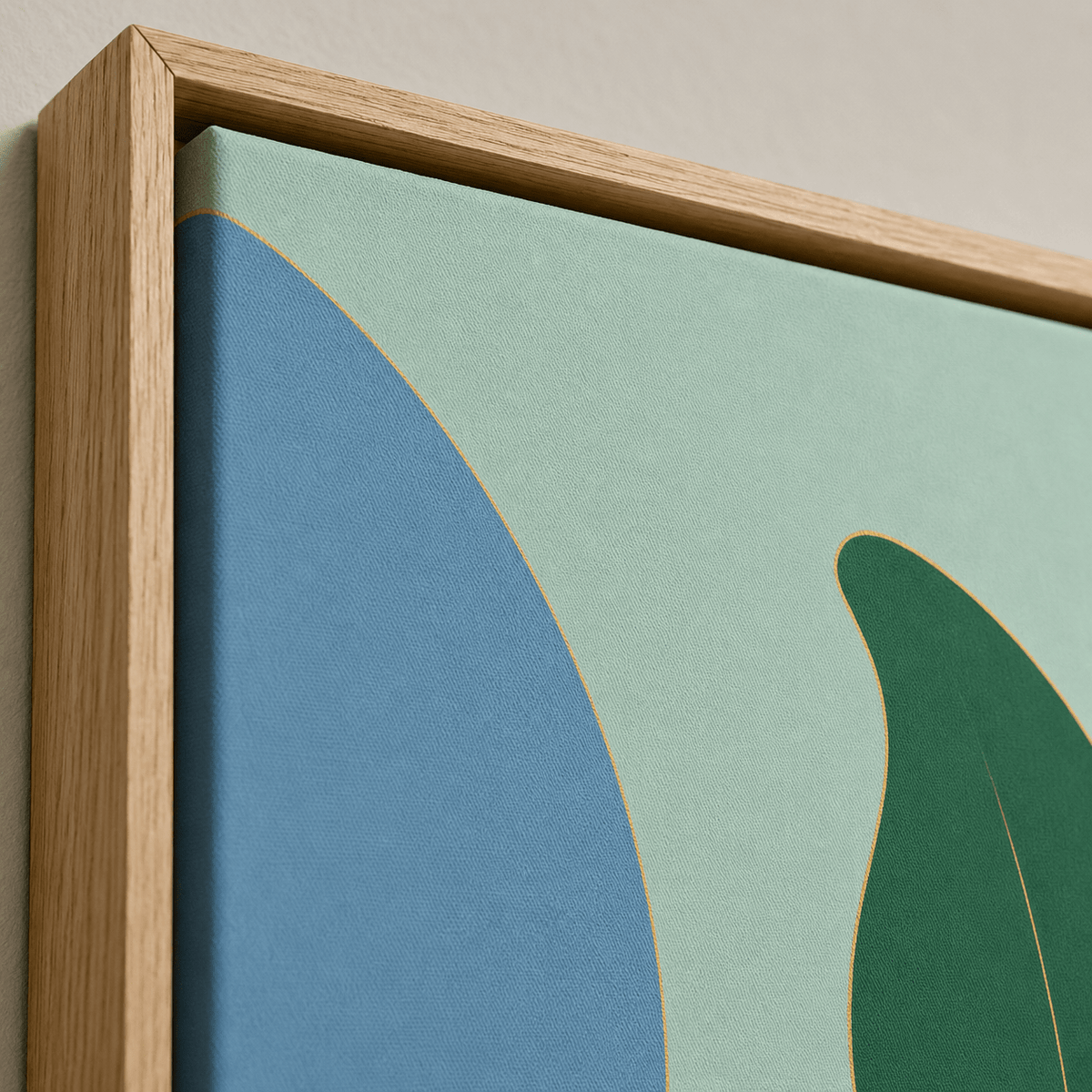 Close-up of green leaf wall art showing the painted texture, colors and hardwood floater frame