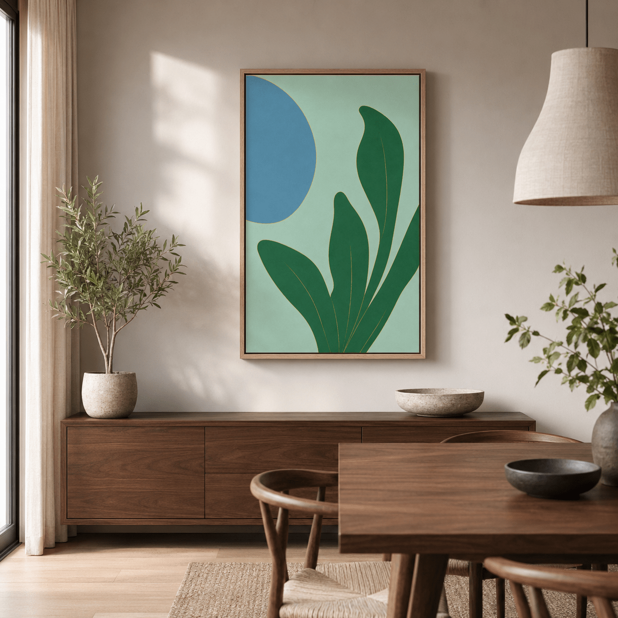 Green leaf wall art in an oak floater frame displayed in a contemporary dining room