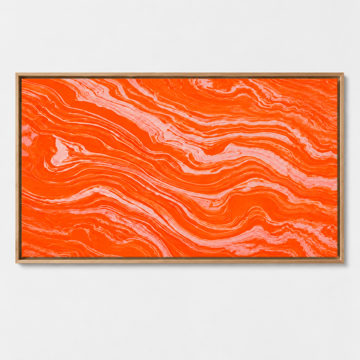Orange abstract art canvas print in an oak floater frame above a living room sofa – Molten Coral by Rossetti Art