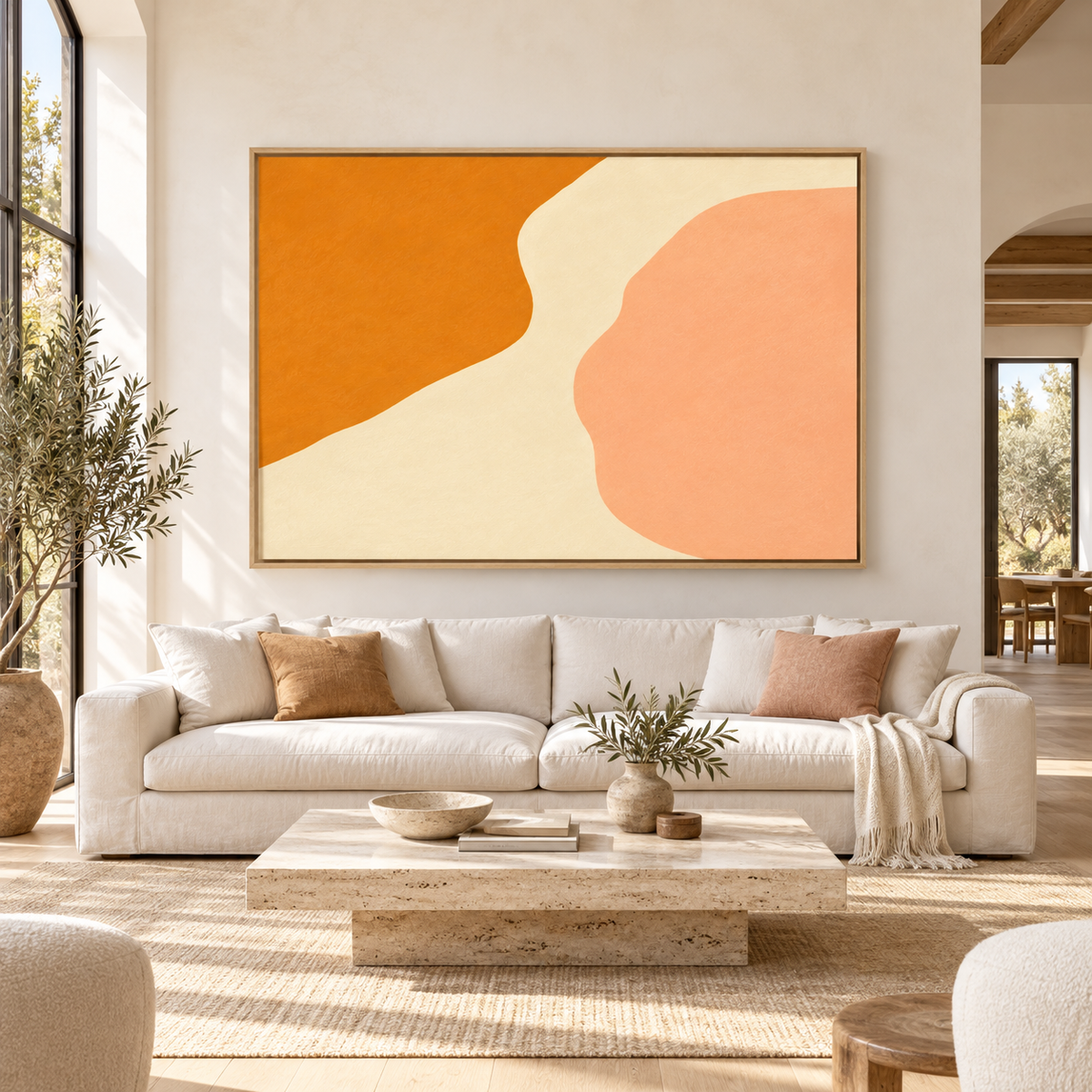 Orange Abstract Wall Art – Warm Current canvas print by Rossetti Art above an ivory sofa in a bright living room