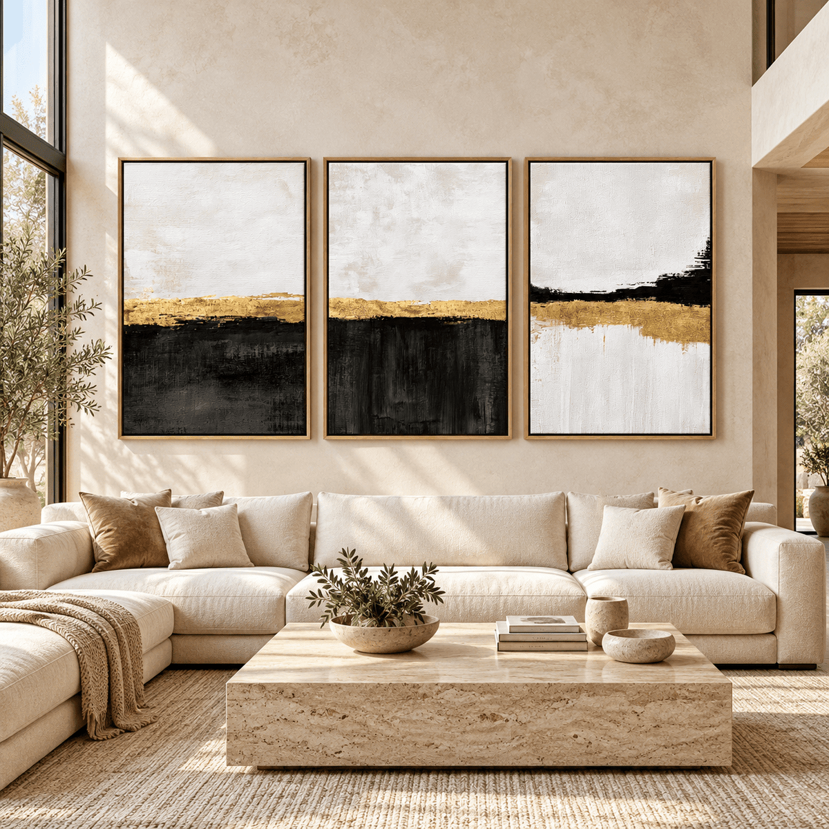 Black White and Gold Wall Art Set of 3 – Gilded Shoreline above a cream sectional sofa in a living room by Rossetti Art