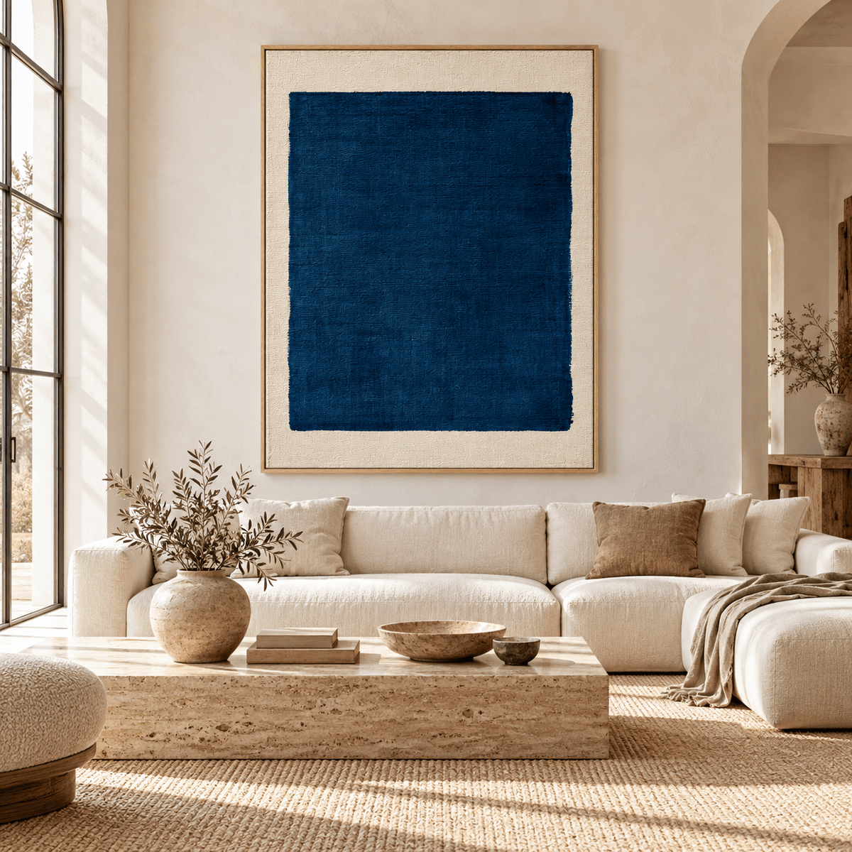 Navy blue painting Indigo Frame above a cream sofa in a living room – Rossetti Art