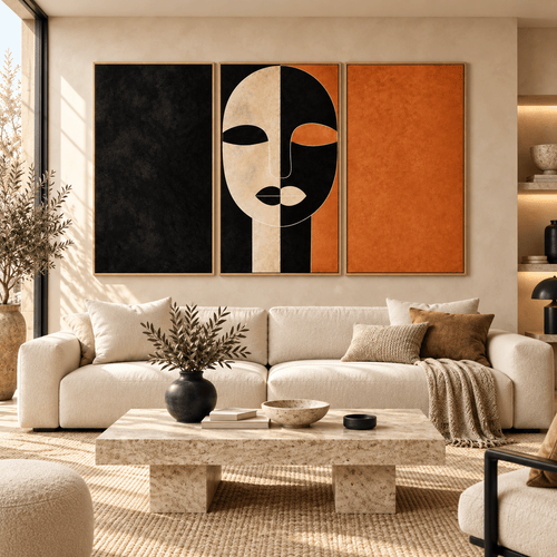 Triptych wall art – Ochre Divide black, cream and terracotta abstract face canvas set with floater frames above a cream sofa in a sunlit living room by Rossetti Art