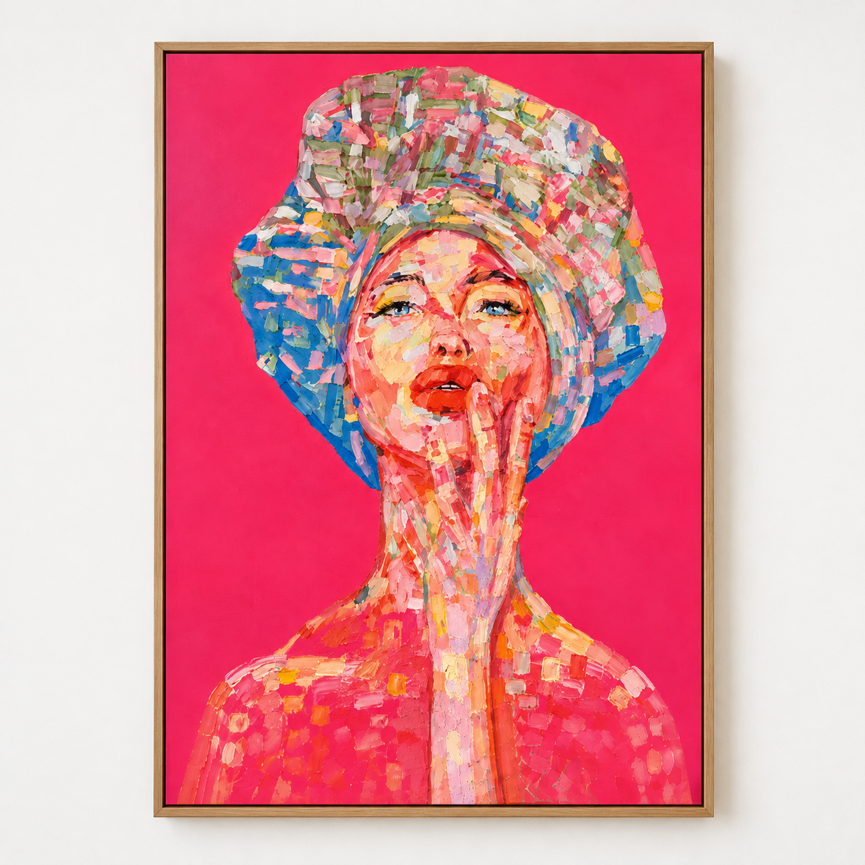 Colorful woman portrait wall art with expressive pink, coral, blue and green brushstrokes on a vivid pink background