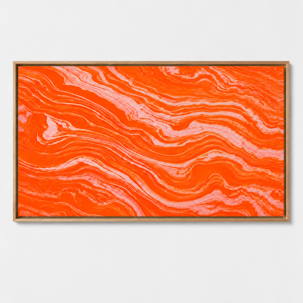 Orange abstract art canvas print in an oak floater frame above a living room sofa – Molten Coral by Rossetti Art