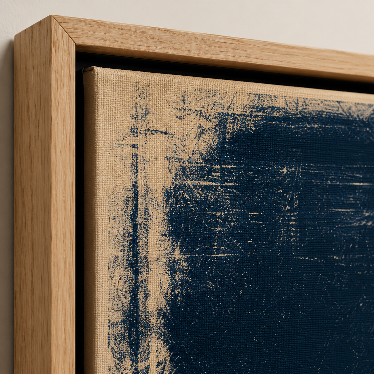 Close-up detail of the textured navy and cream feather painting canvas