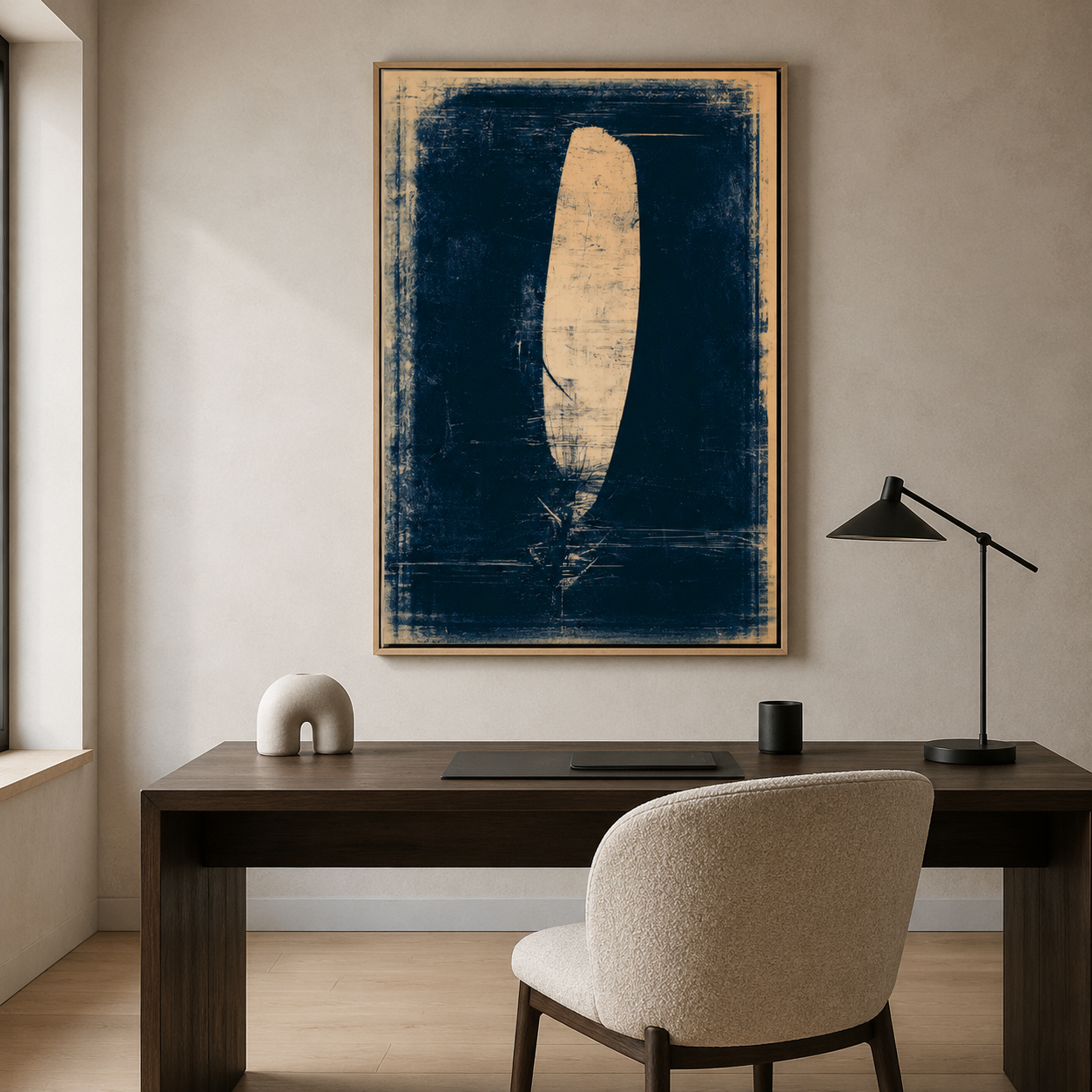 Feather painting displayed above a desk in a home office