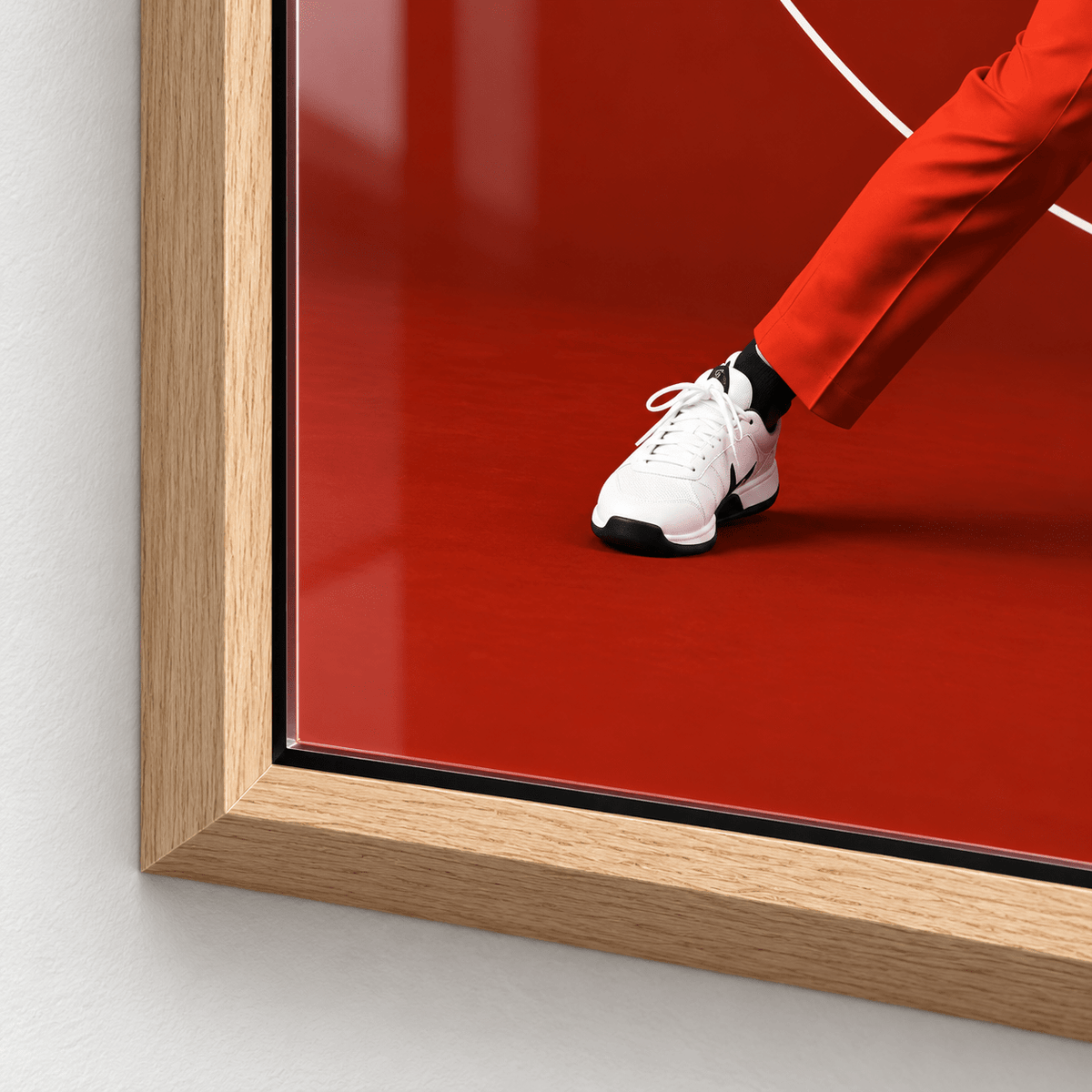 Close-up of the glossy acrylic surface and frame corner of the tennis decor print