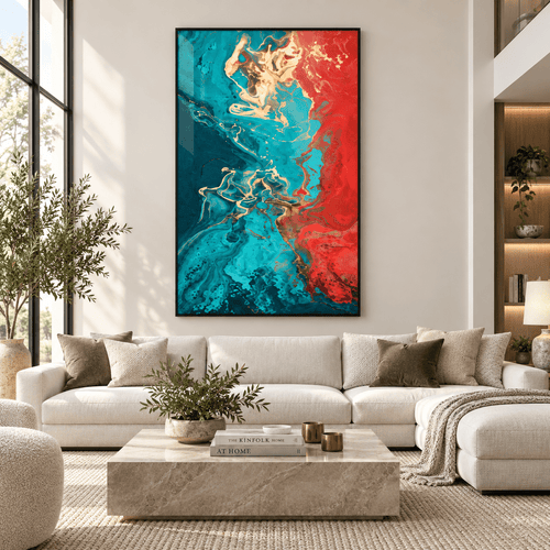 Turquoise wall art – red, gold and turquoise fluid abstract acrylic print in a black frame above a cream sofa in a bright living room by Rossetti Art
