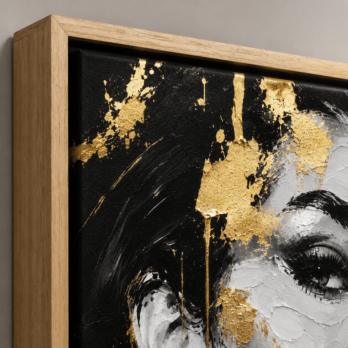Close-up detail of the oak frame corner and gold paint texture on the Gilded Muse black and gold painting