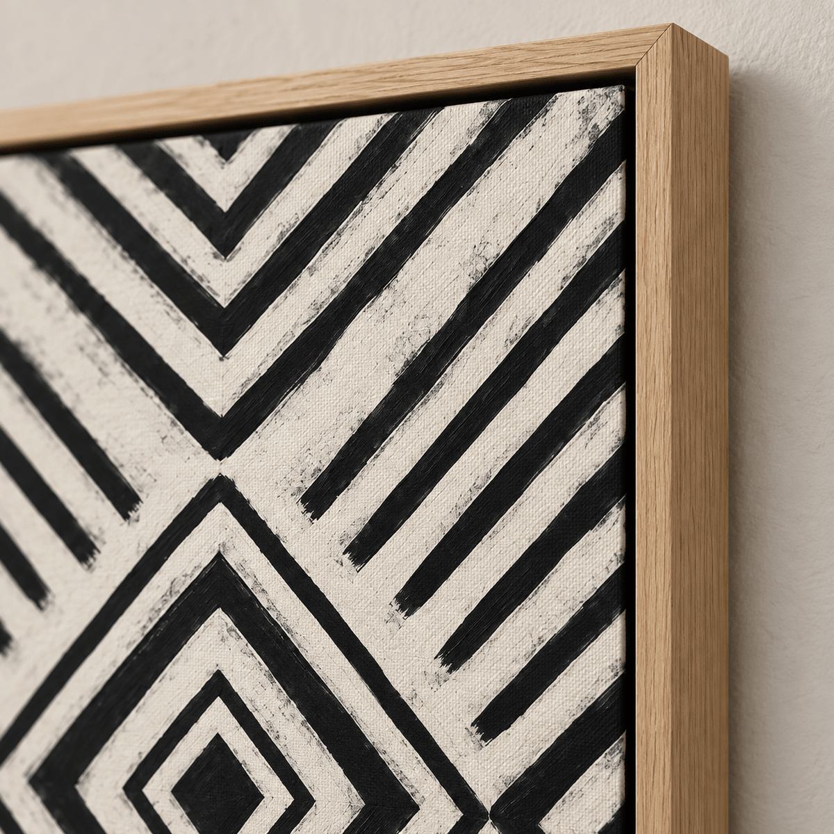 Close-up corner detail showing the texture and oak floater frame of the geometric canvas print