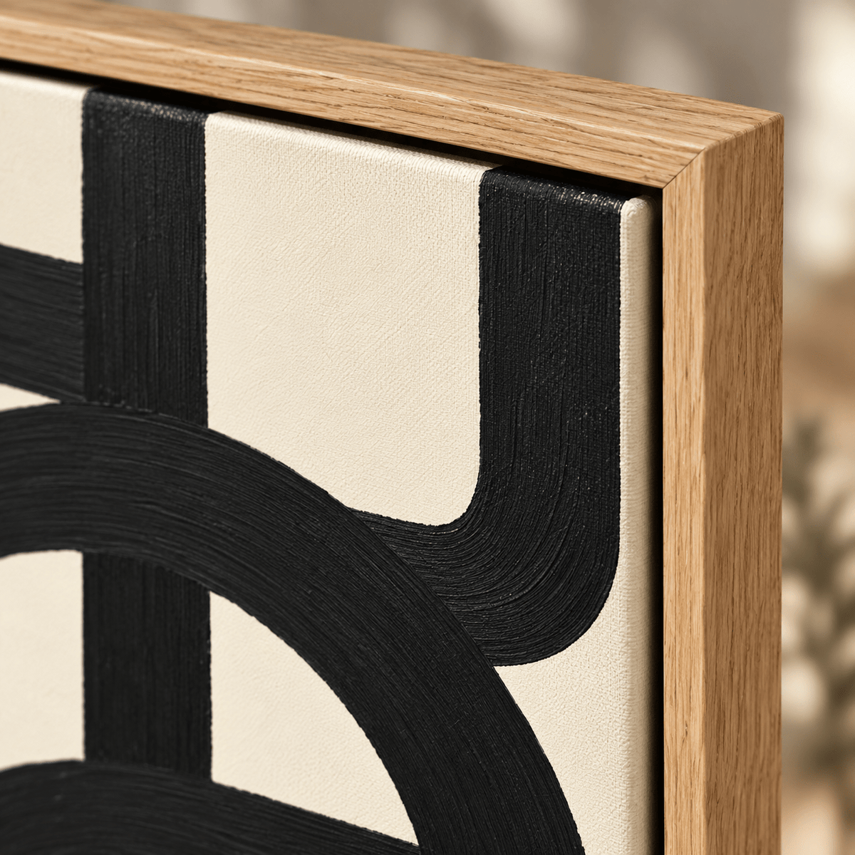 Close-up detail of black brushwork and oak floater frame on Interwoven Rhythm