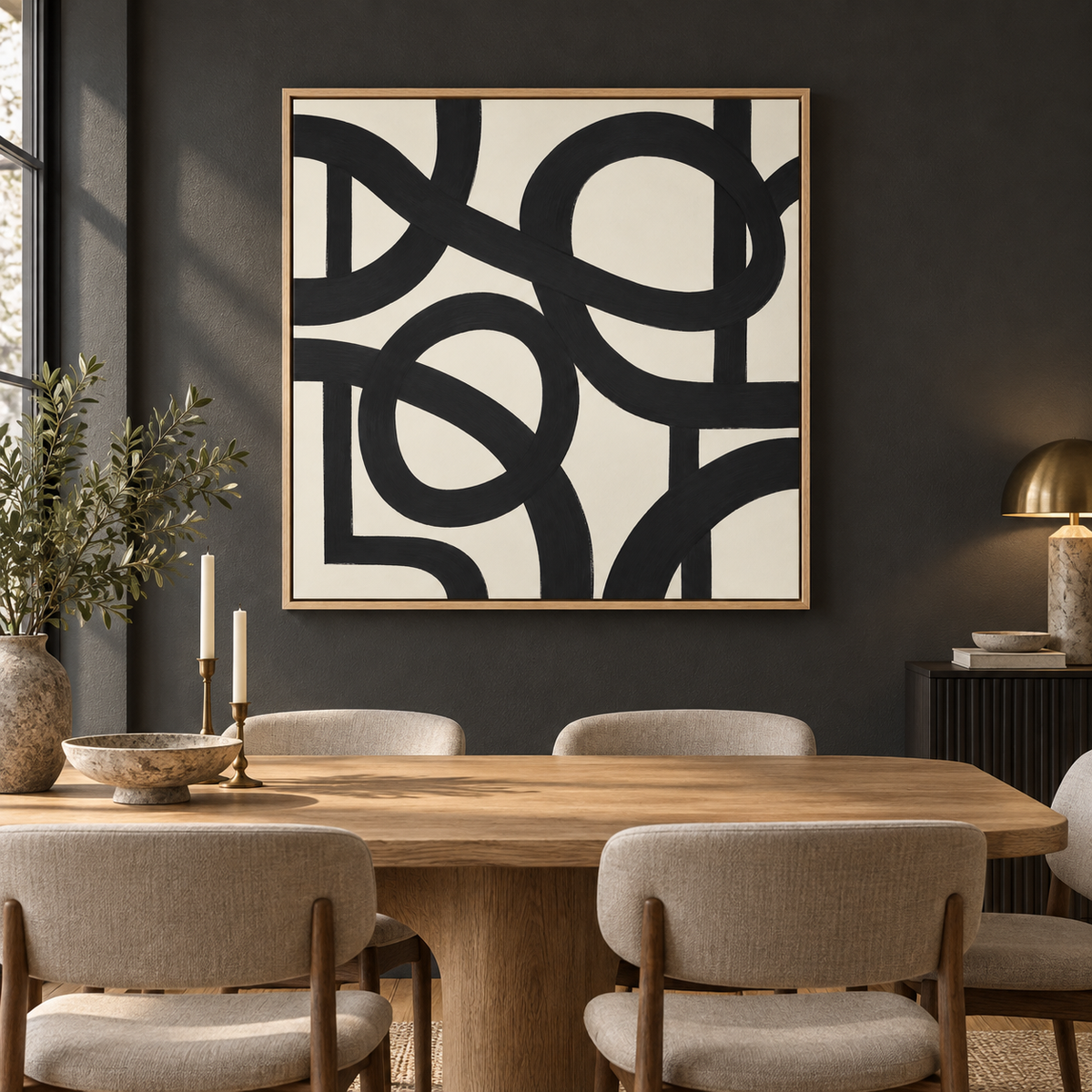 Black and ivory abstract painting displayed in a modern dining room