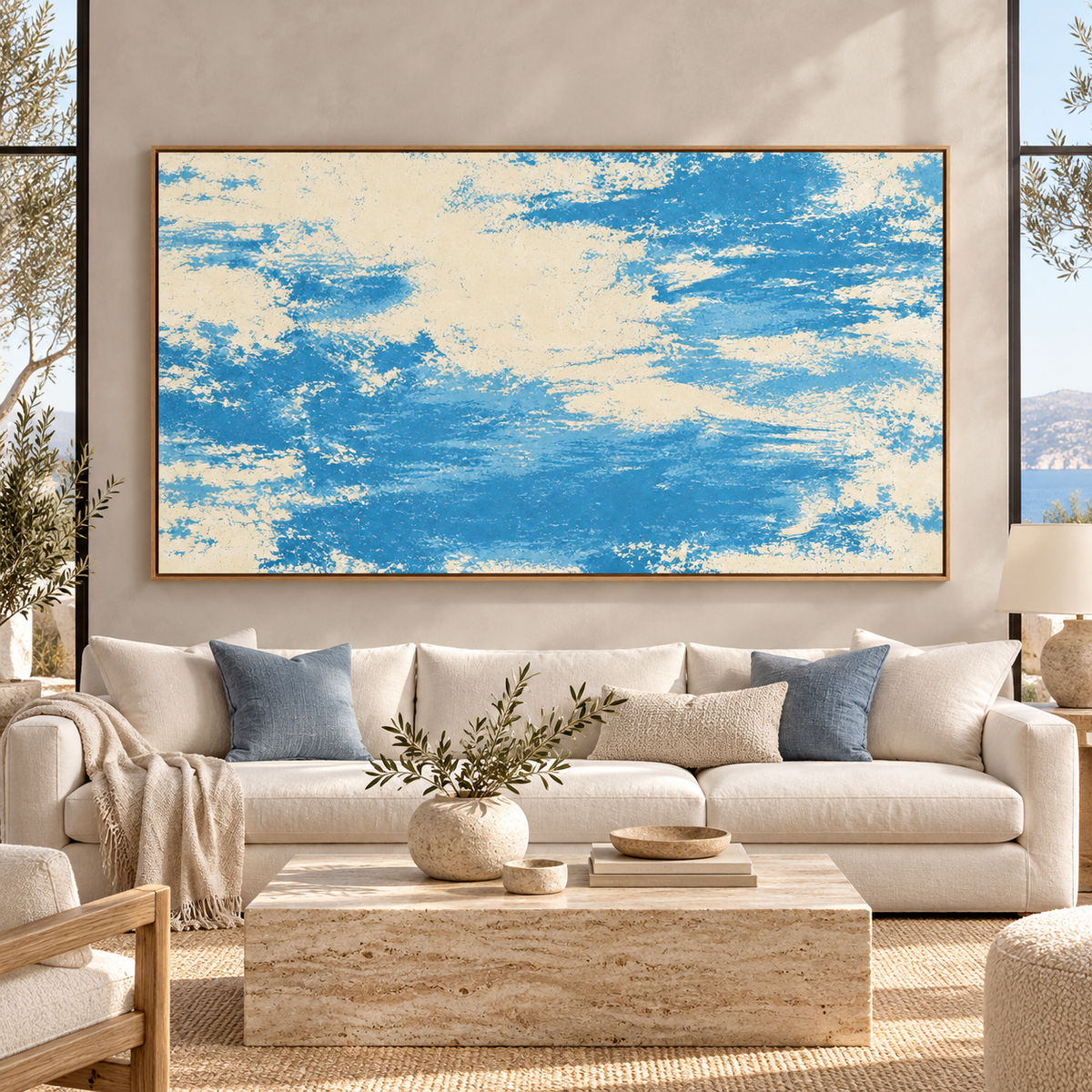 Blue and Beige Wall Art – Salt Wash by Rossetti Art – wide blue and cream abstract canvas above a cream sofa in a coastal living room