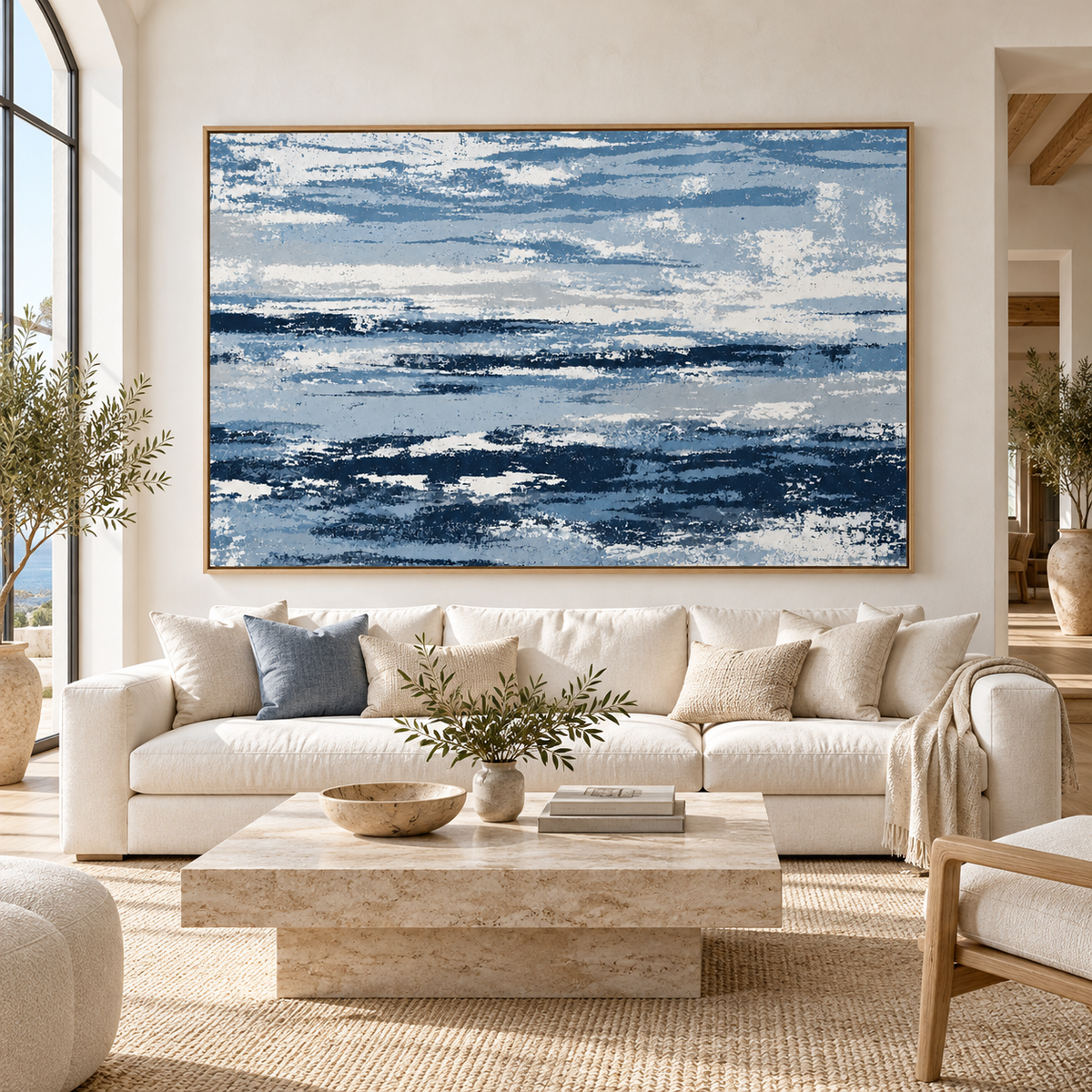 Blue and White Wall Art – Salt Current by Rossetti Art – large navy, denim and white abstract canvas above a cream sofa in an arched living room