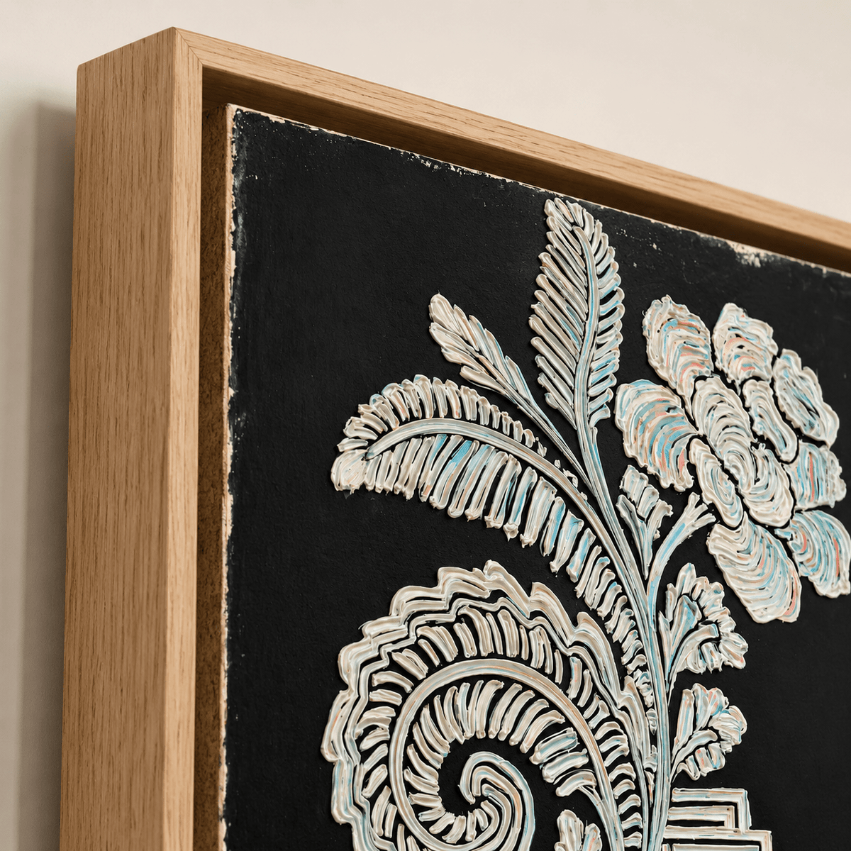 Close-up of black and white botanical wall art canvas showing textured impasto floral detail and hardwood floater frame