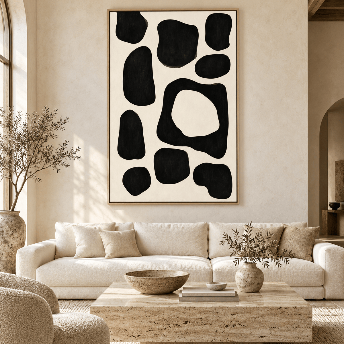 Abstract Shapes Wall Art – Ink Pebbles black and cream canvas print above a sofa by Rossetti Art