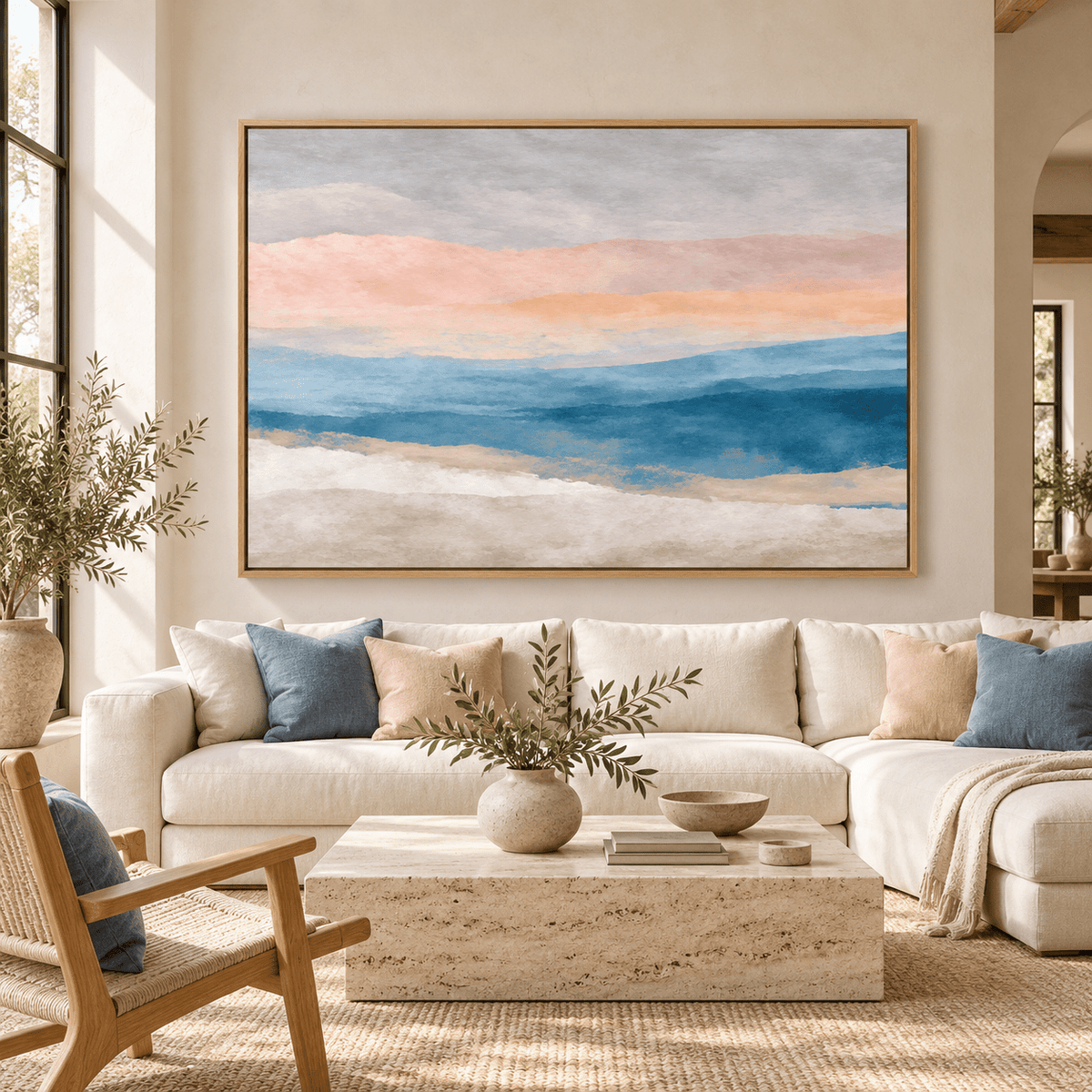 Blue and gray wall art Muted Horizon above a linen sofa in a bright living room