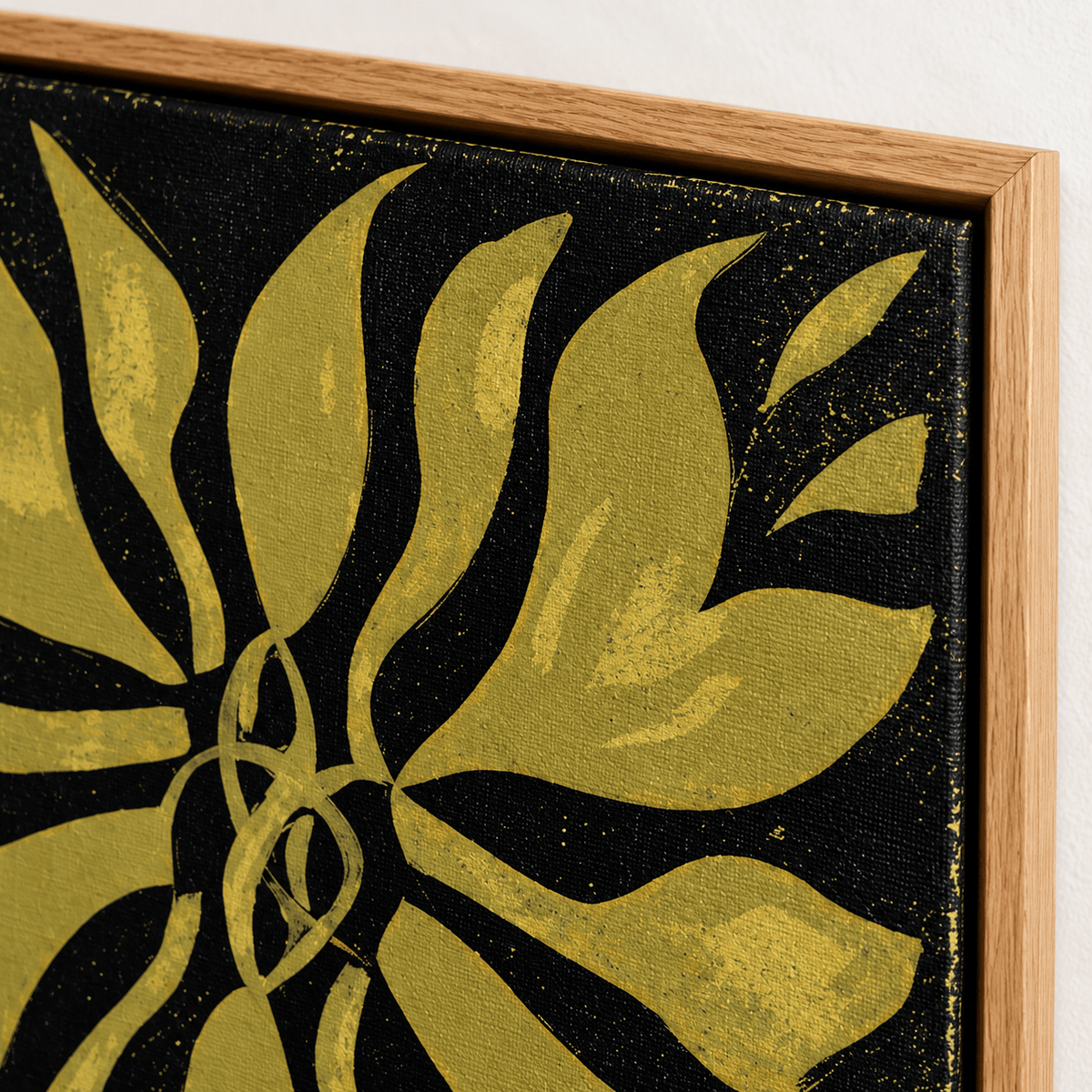 Close-up of gold and black botanical fern canvas print texture and oak floating frame corner