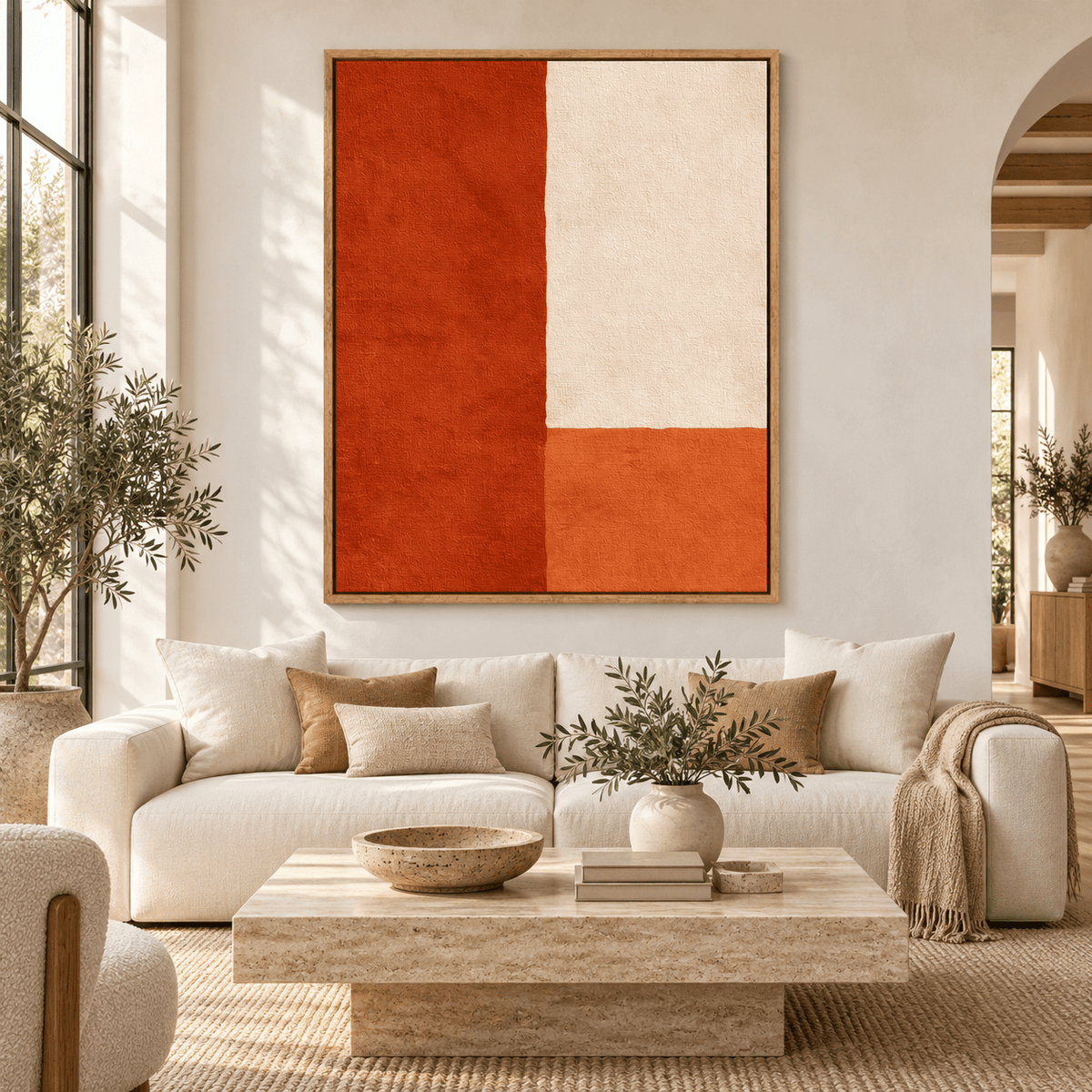 Color block art – Terra Divide orange and cream canvas print above a cream sofa in a bright living room by Rossetti Art