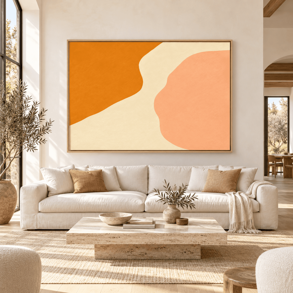 Orange Abstract Wall Art – Warm Current canvas print by Rossetti Art above an ivory sofa in a bright living room