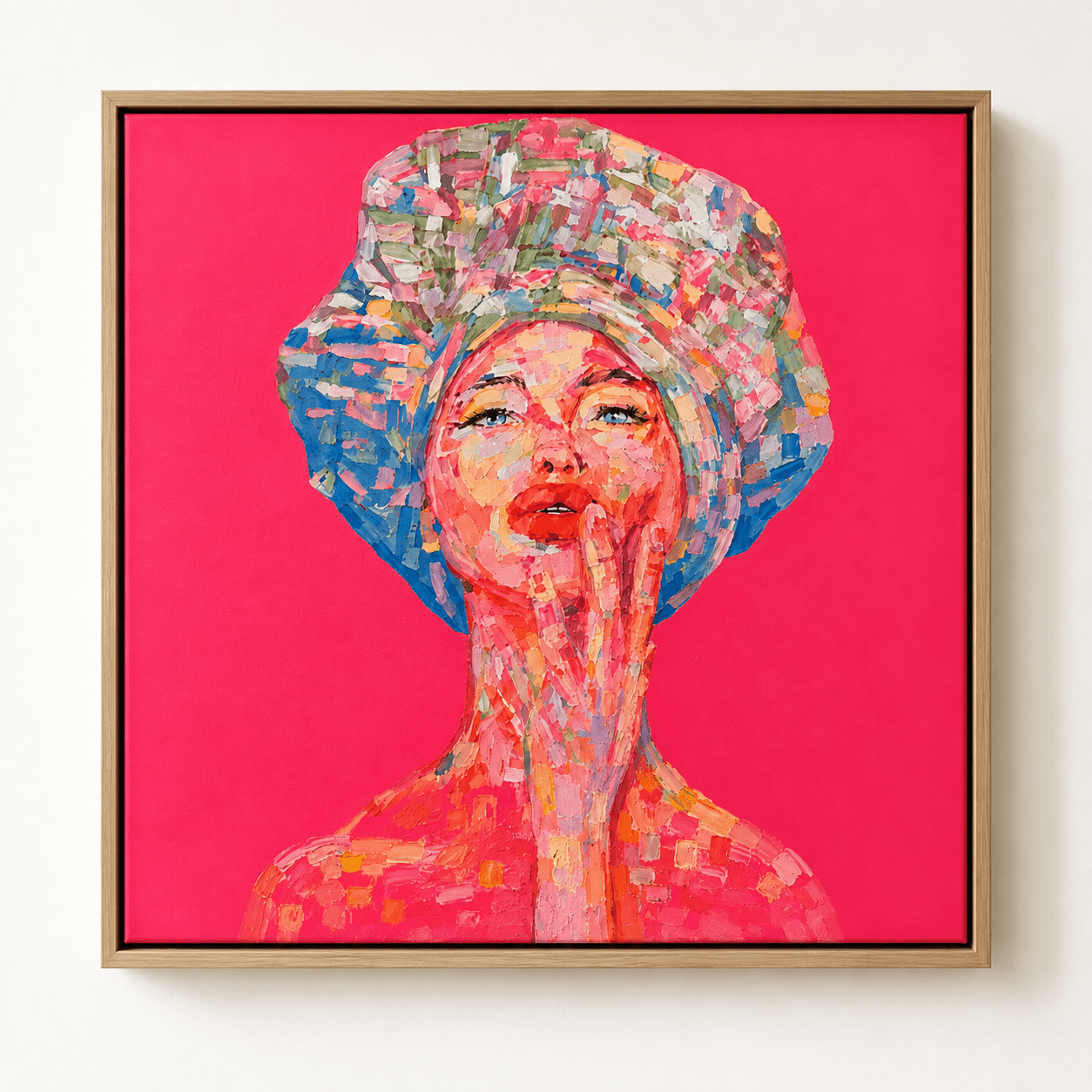 Colorful woman portrait wall art with expressive pink, coral, blue and green brushstrokes on a vivid pink background