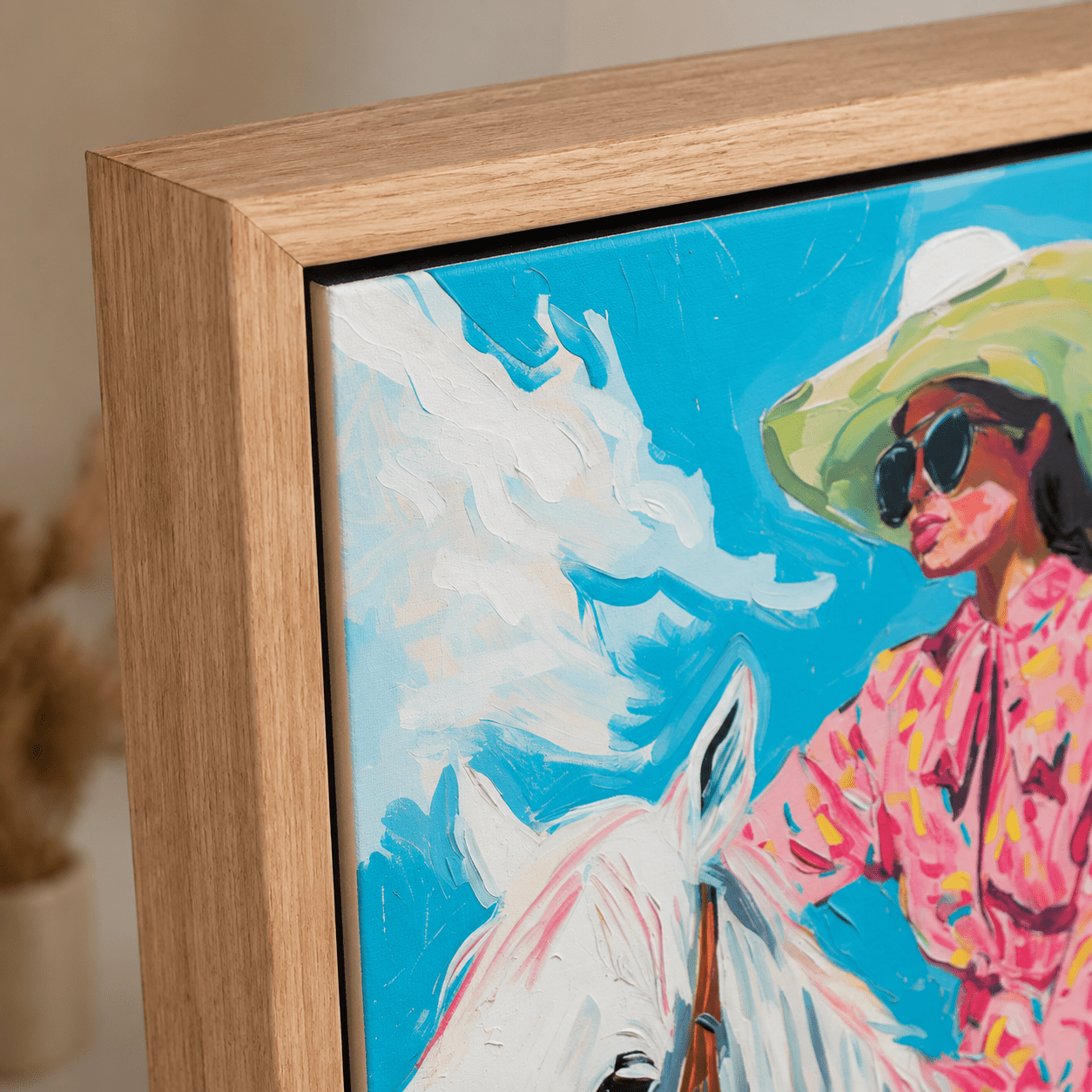 Cowgirl wall art prints with a rider in a pink floral outfit beside a white horse under a wide-brimmed hat