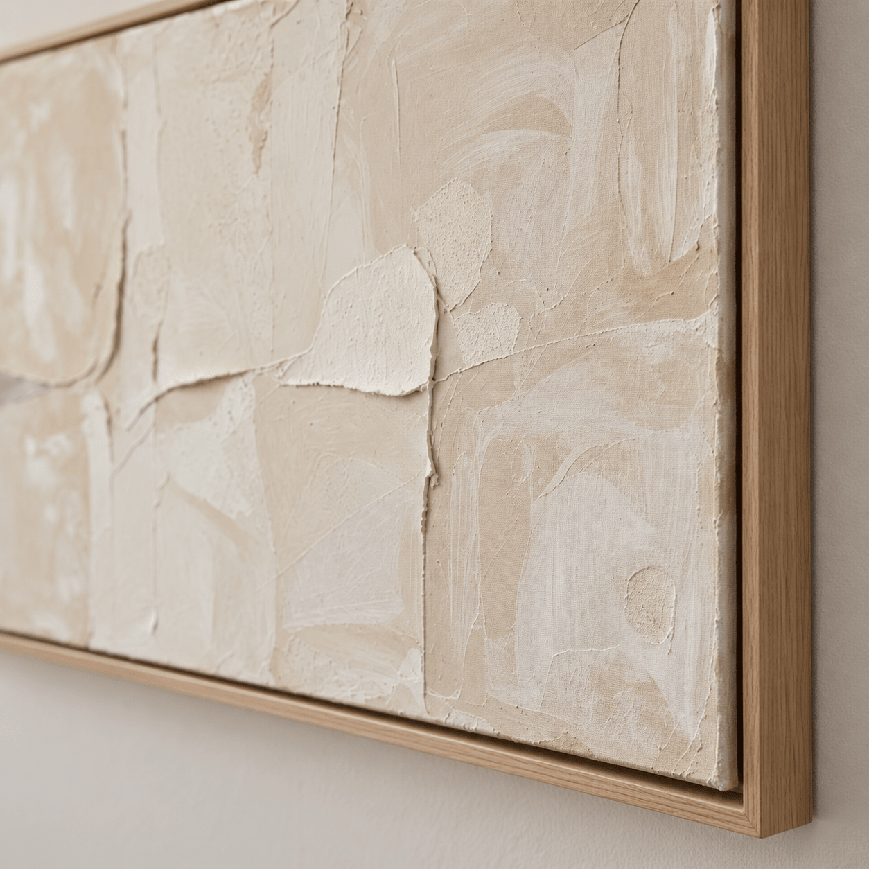 Close-up detail of the plaster-textured surface and oak float frame on the Quiet Plaster cream abstract painting by Rossetti Art