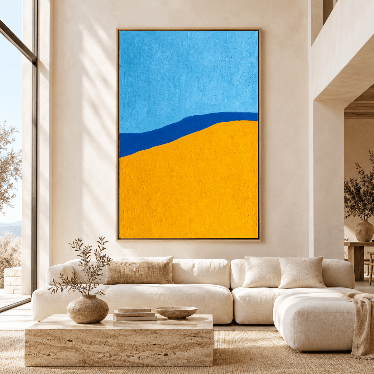 Blue and yellow painting Cobalt Ridge above a cream sofa in a living room – Rossetti Art
