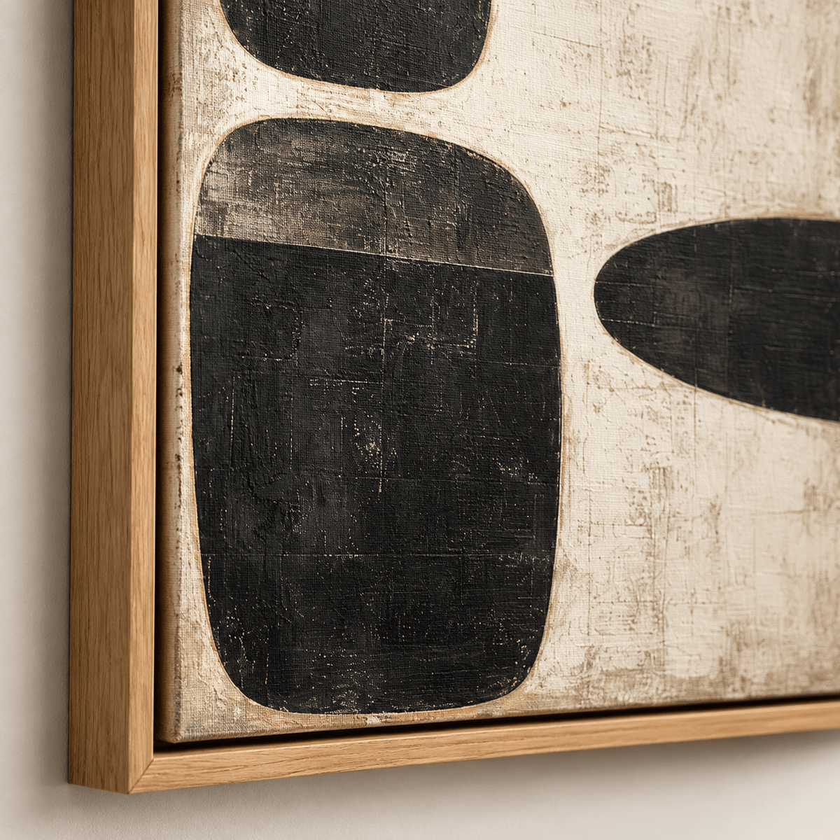 Close-up of textured black and cream painting in a wood floater frame – Three Stones by Rossetti Art