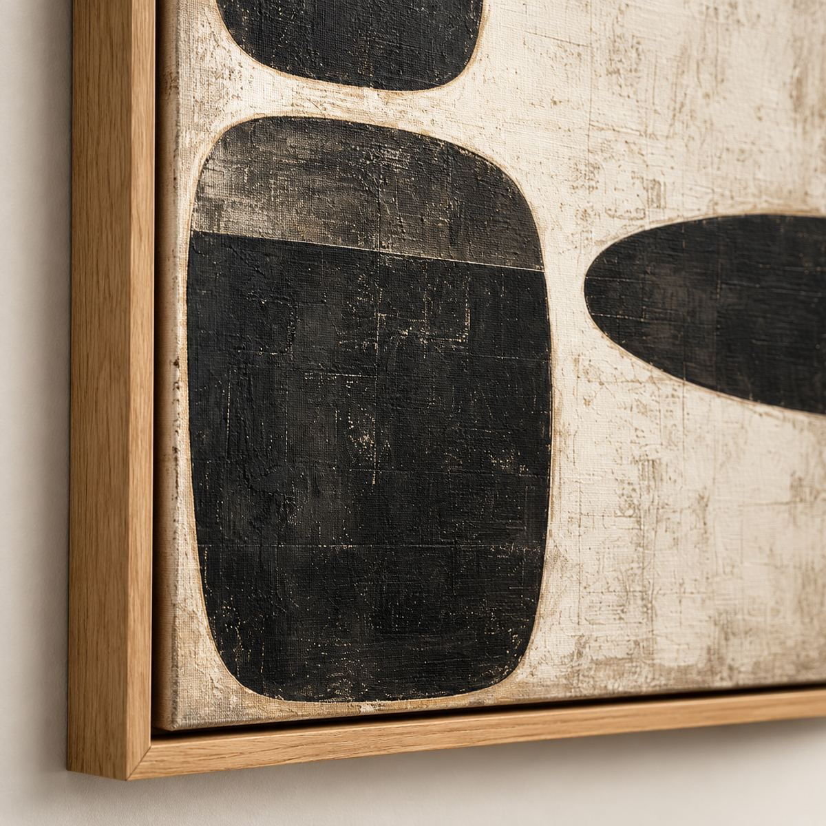 Close-up of textured black and cream painting in a wood floater frame – Three Stones by Rossetti Art