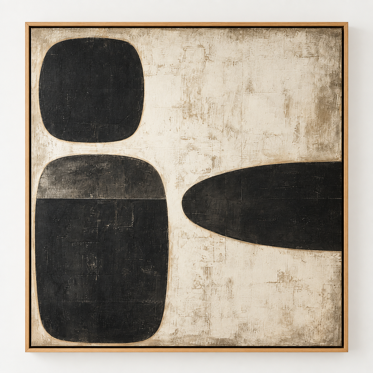 Pebble wall art, three black stone forms on a weathered cream canvas in a wood floater frame – Three Stones by Rossetti Art