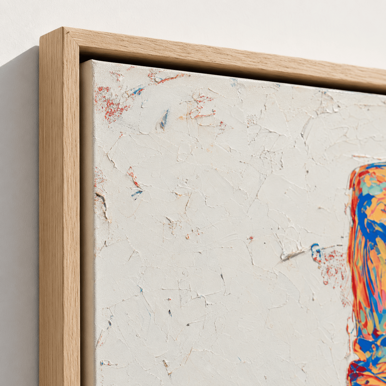 Close-up detail of the oak floater frame and thick palette-knife texture on the Neon Wheels pop art painting