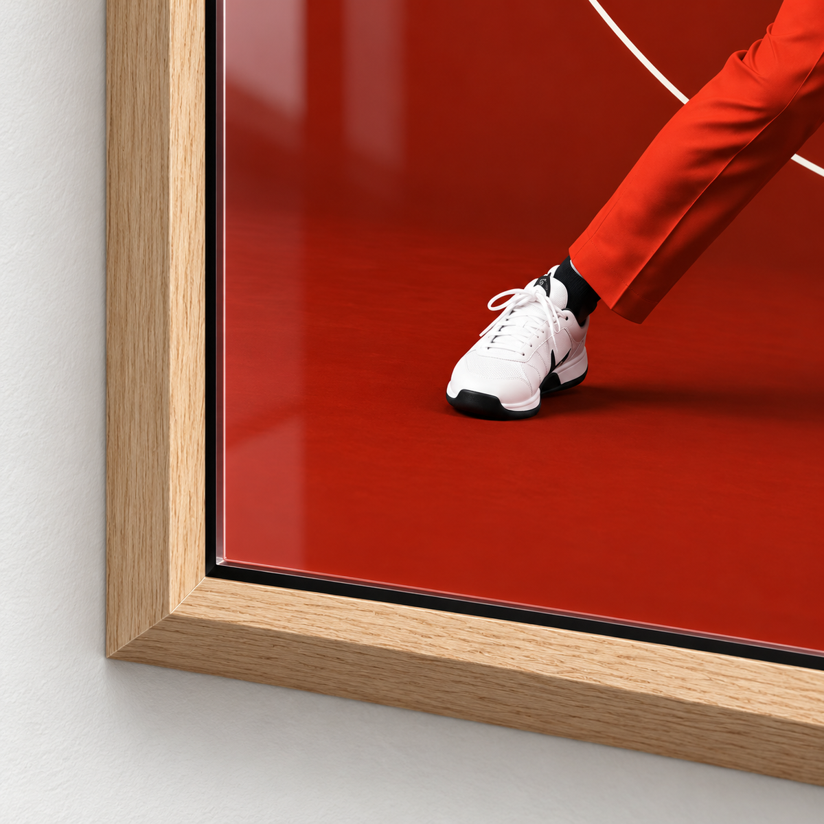 Close-up of the glossy acrylic surface and frame corner of the tennis decor print